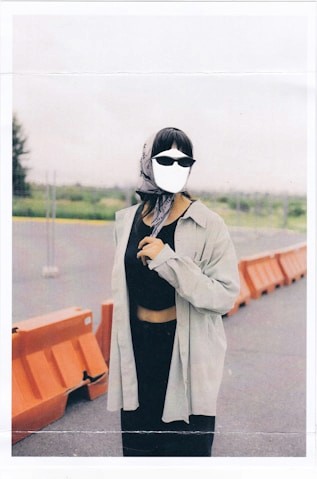 woman standing in black dress