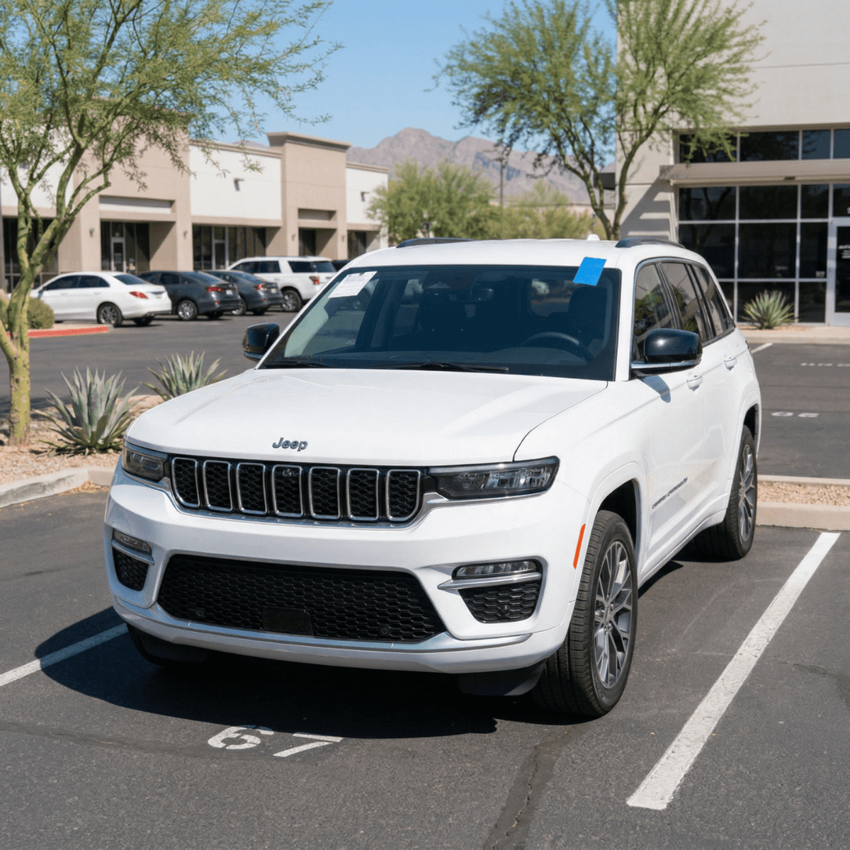 Mobile windshield repair on a white Jeep Grand Cherokee at a Surprise, AZ business park