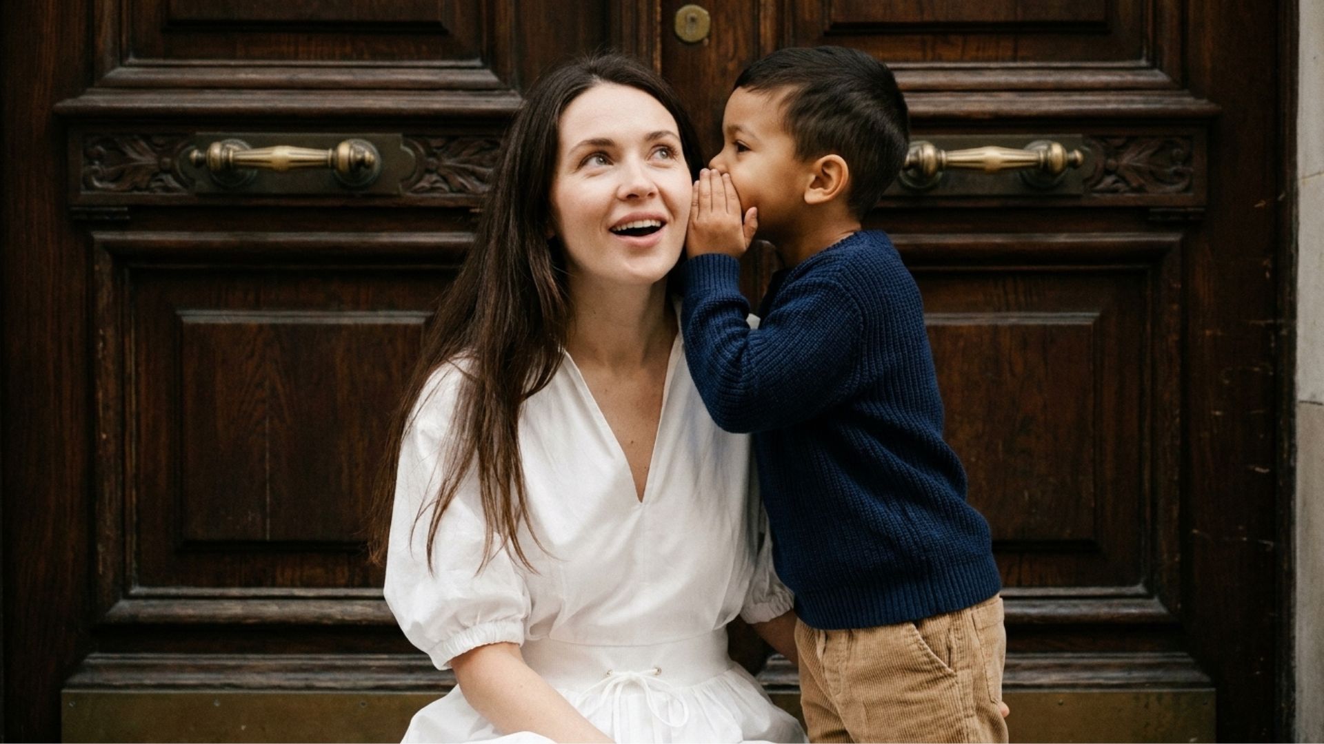 son whispering in his mothers ear