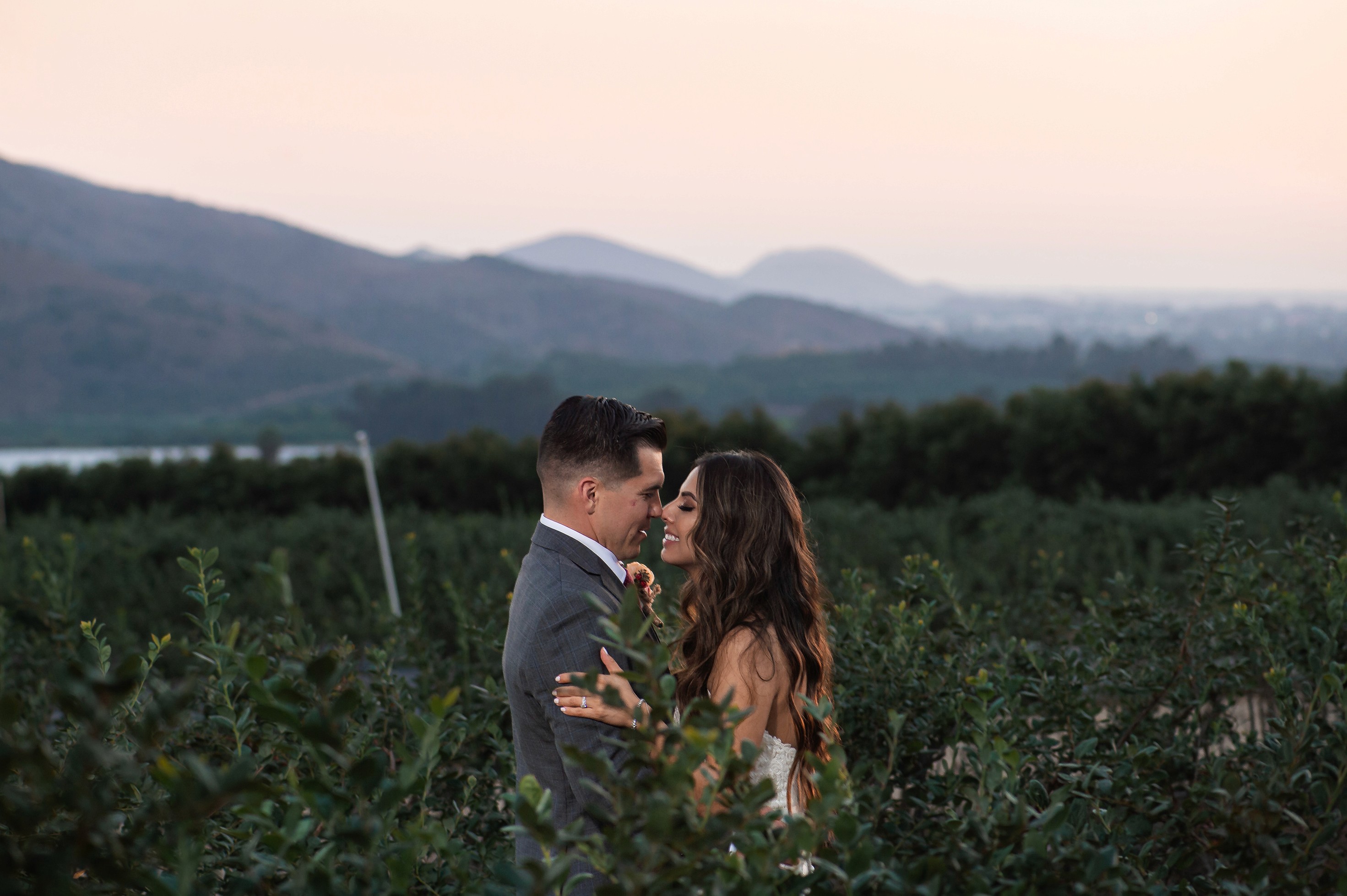 Bride and groom portraits with mountains in the background at Gerry Ranch