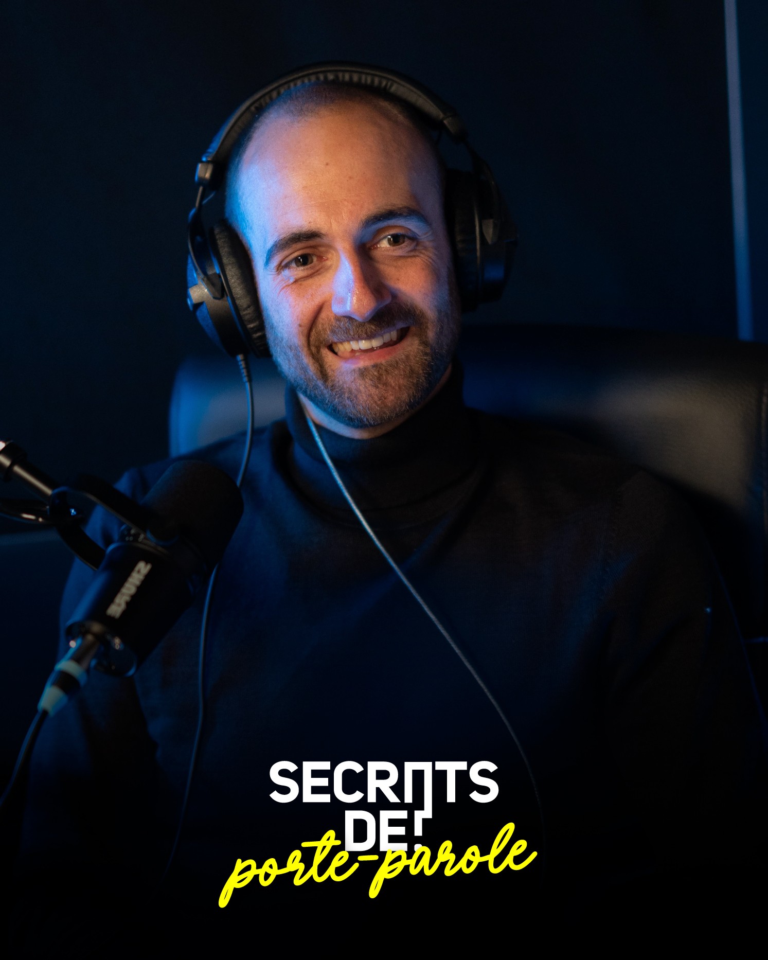 Modern home office setup with a monitor, ergonomic chair, keyboard, and indoor plants near a window with blinds.