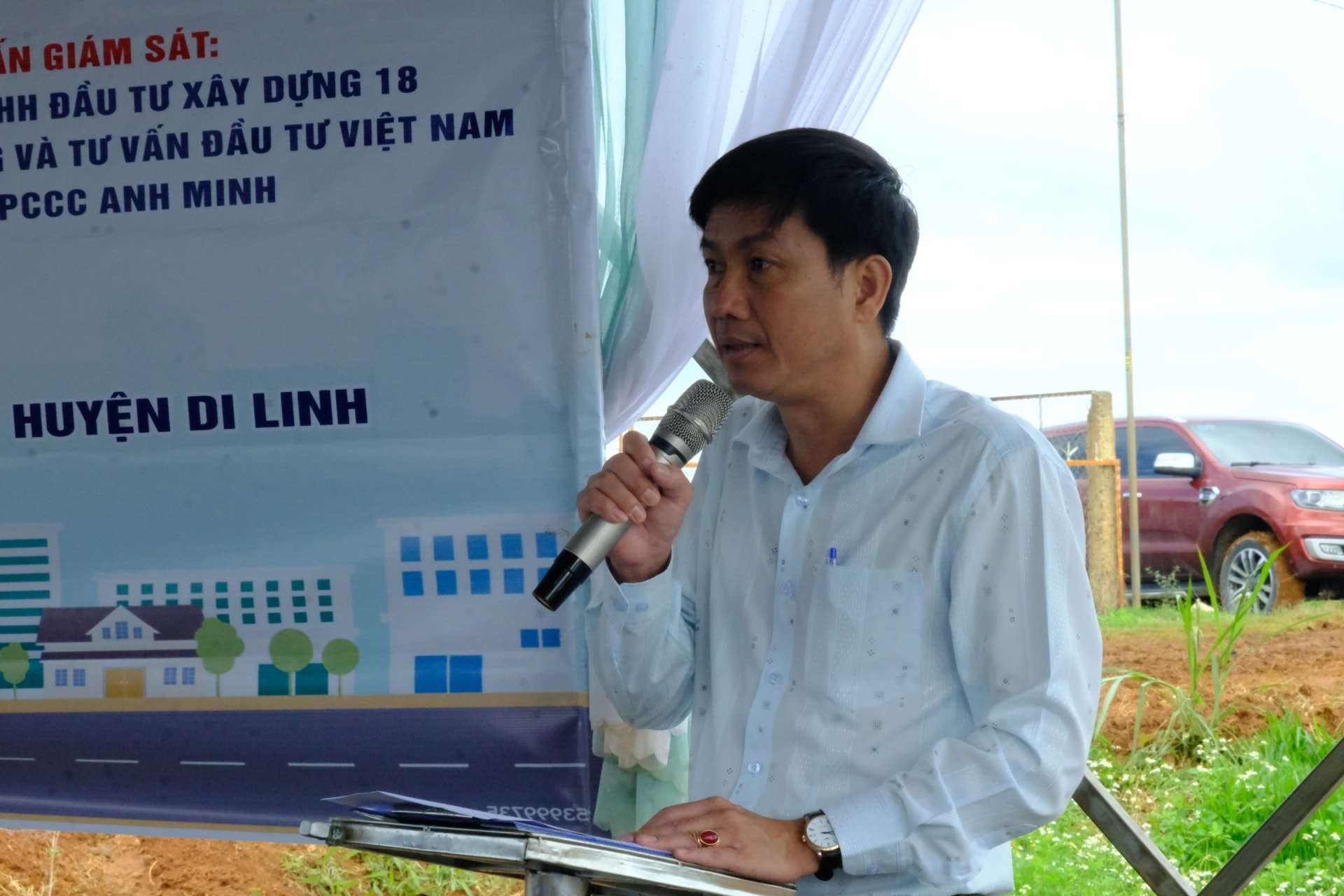 Orange kubota track loader parked on gravel road.