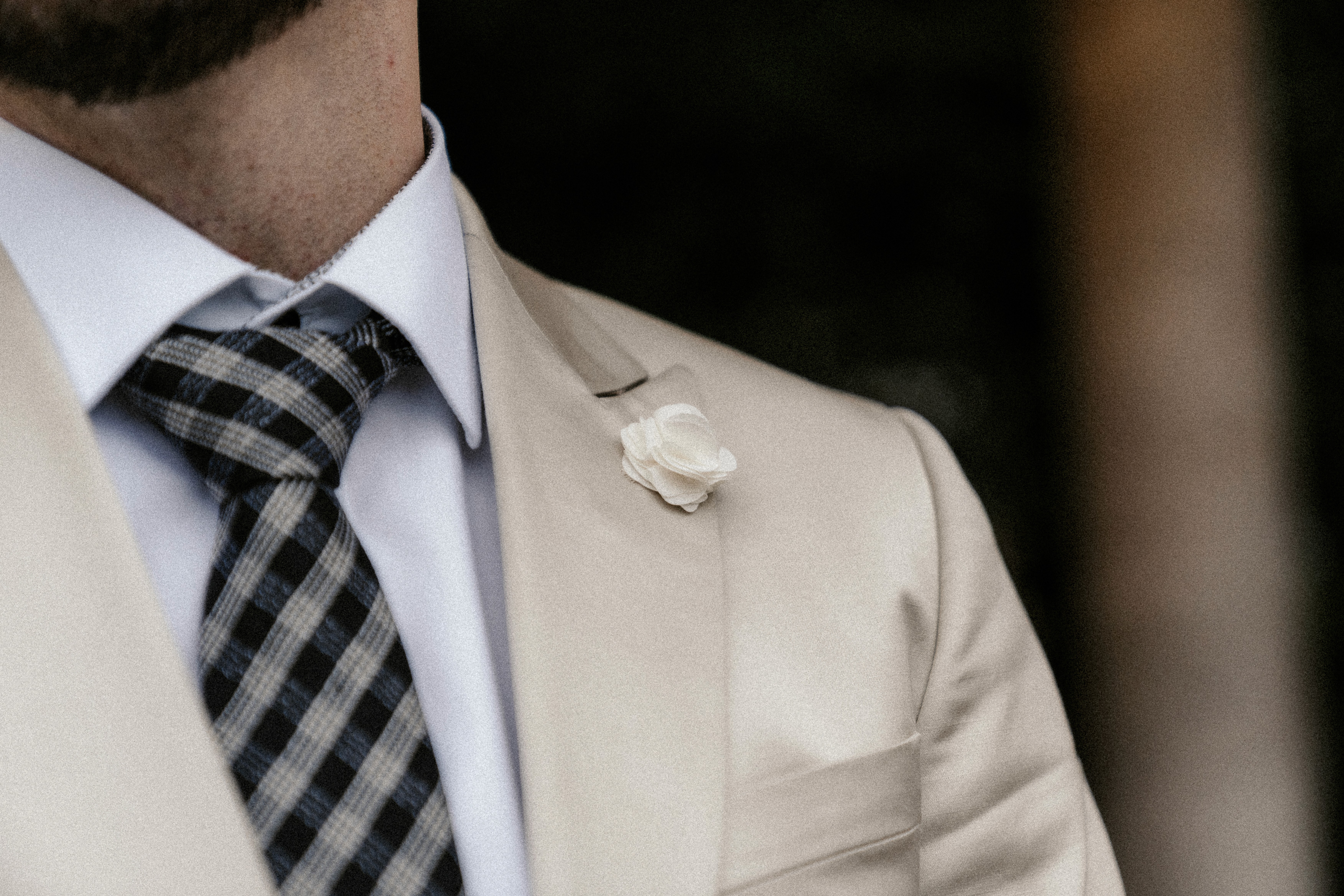 a woman holding a red flower