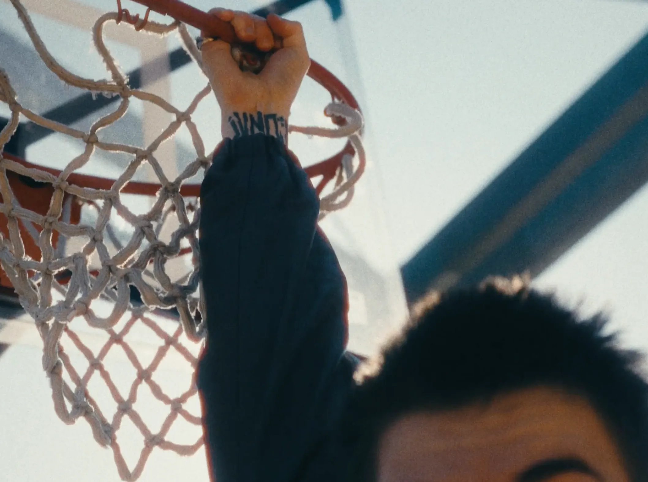 A man holding on to a basket for a music video by X Anima