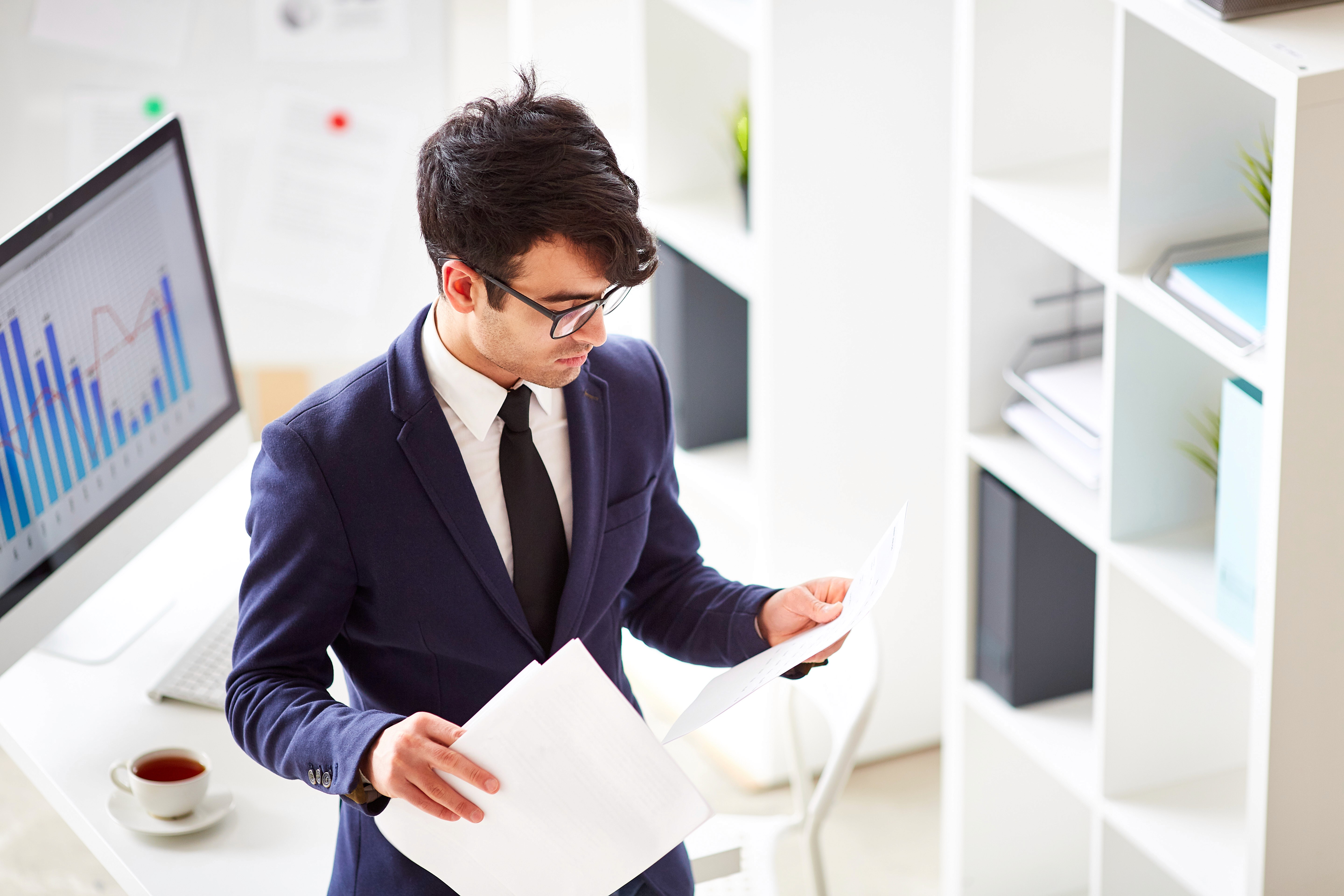Abstract blurred motion of people working in a colorful office.