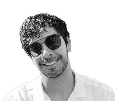 Picture of a man with sunglasses smiling next to water behind him is a yellow railing