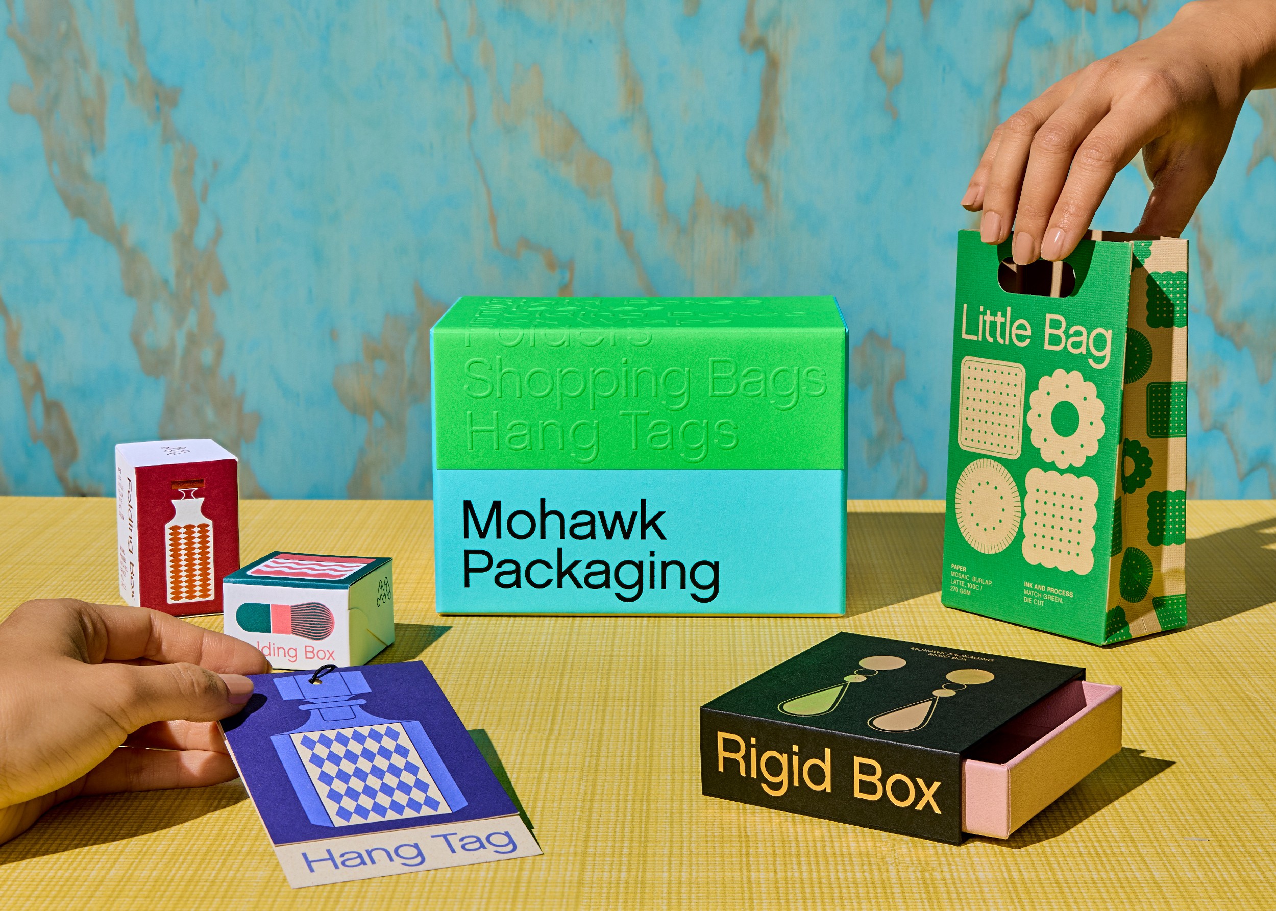 Streetside billboard with flyposters of the Batch.Works brand and illustrations