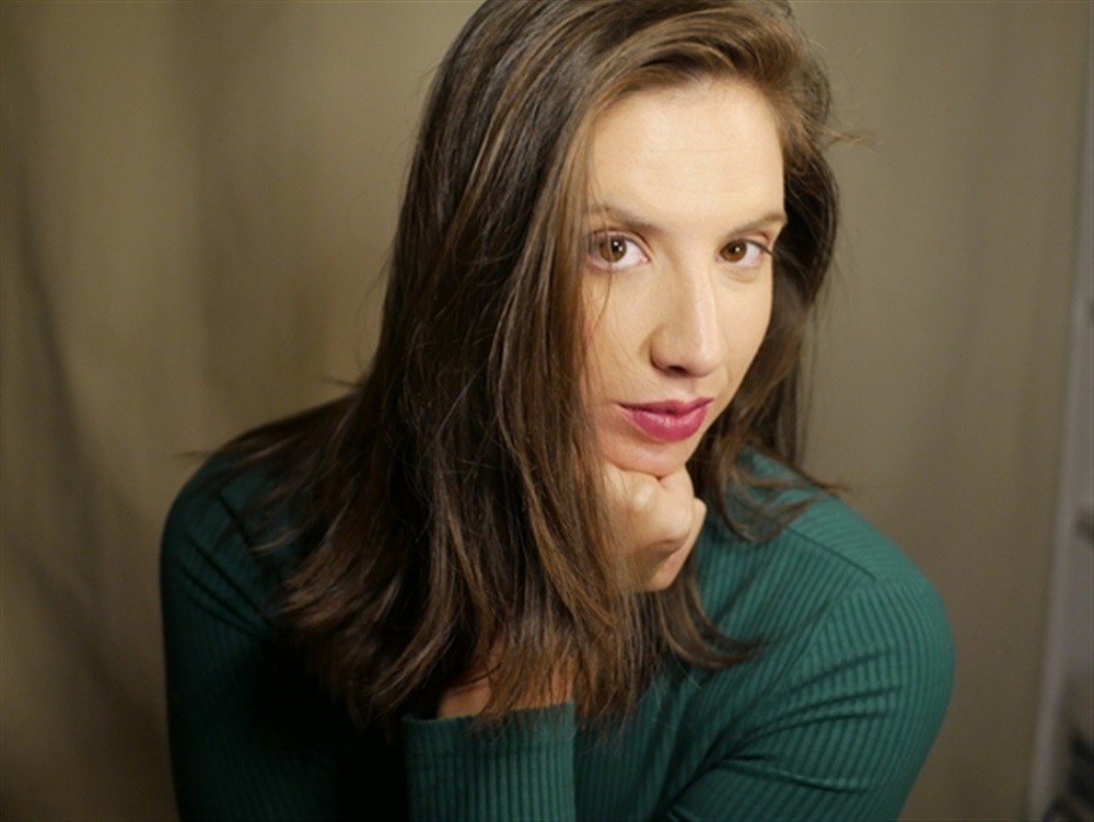 woman in white crew neck shirt smiling