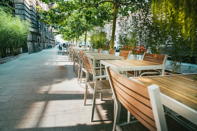 Row of vacan tables and chairs
