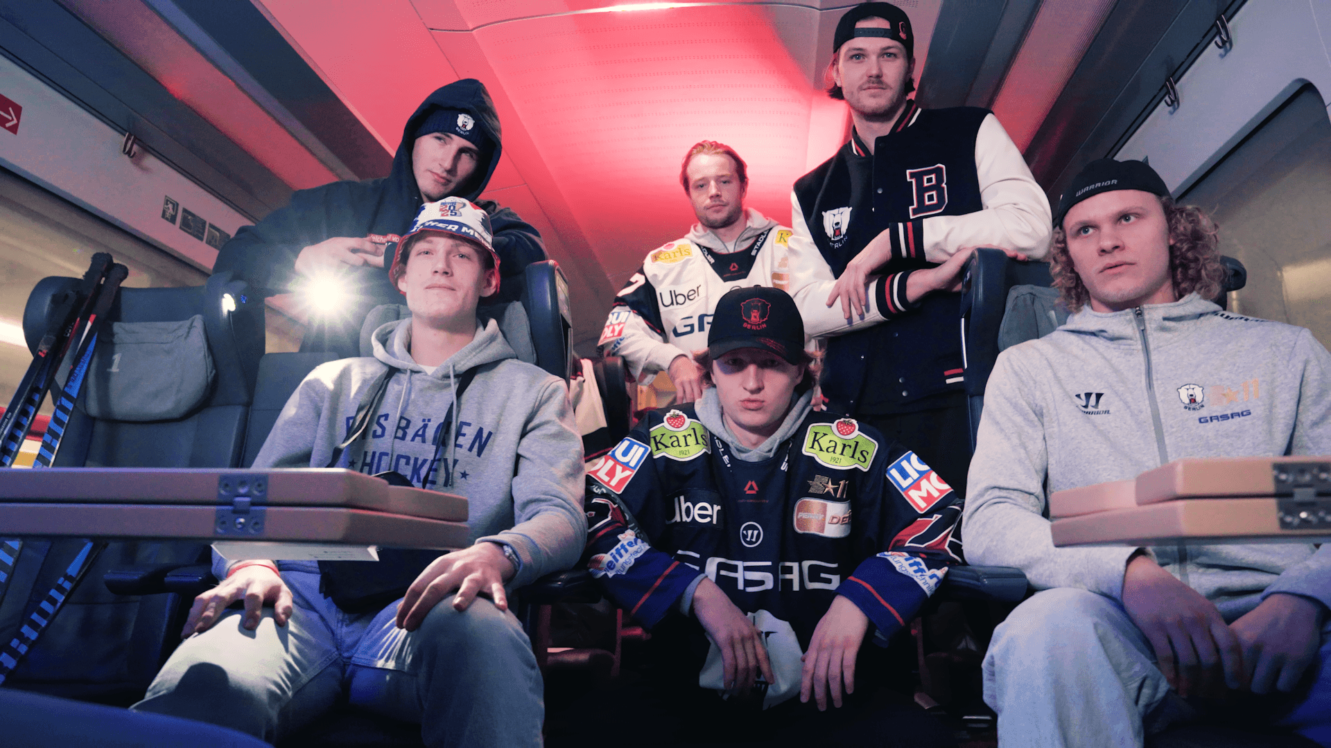 6 eisbaeren berlin ice hockey players looking into camera for the deutsche bahn music video