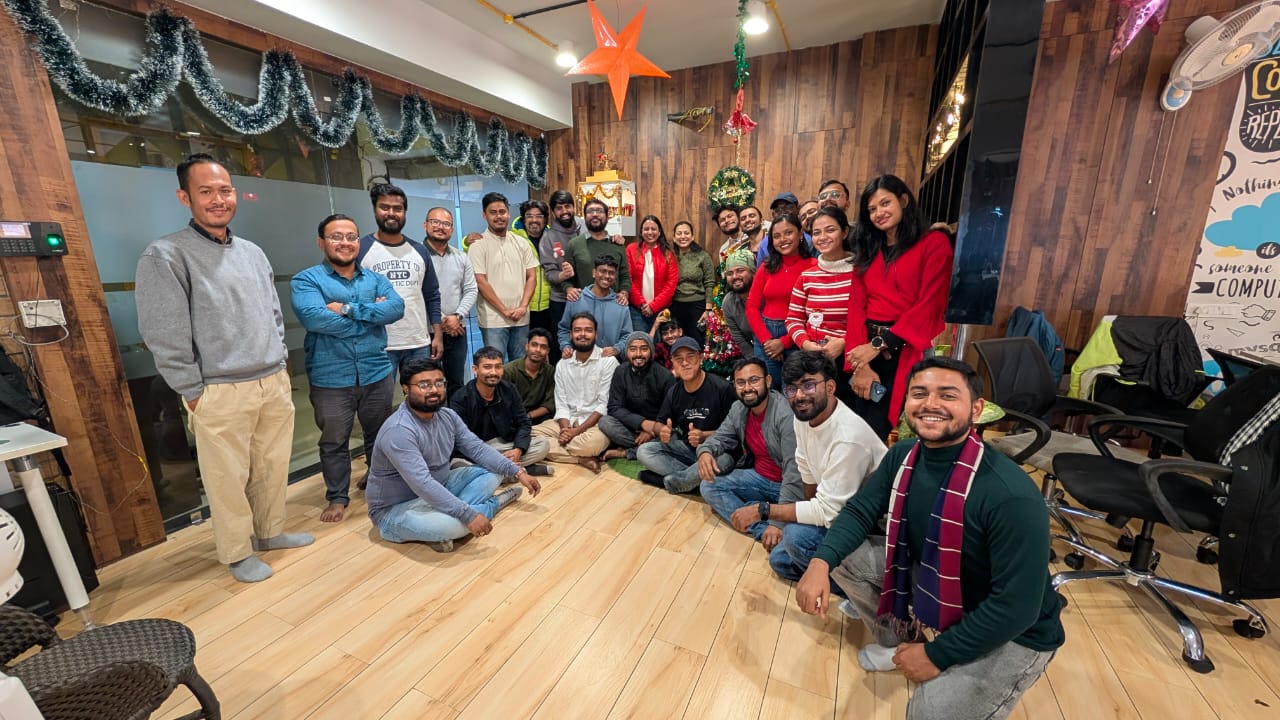 a man sitting in front of a laptop computer