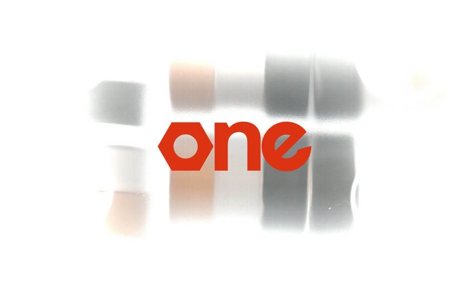 ONE logo with a photo behinf that has a unique motion blur against a wait background.