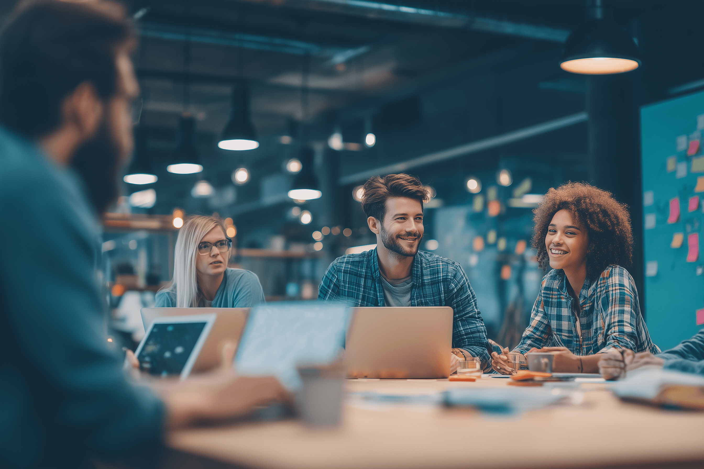 people sitting on chair in front of laptop computers