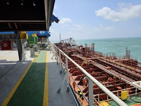 Ship-to-ship bunkering at Santos anchorage, coordinated by CARGOWARD®, showing fuel transfer setup and operational interface on deck.