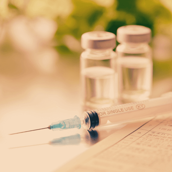 closeup image of lip filler needle and vials