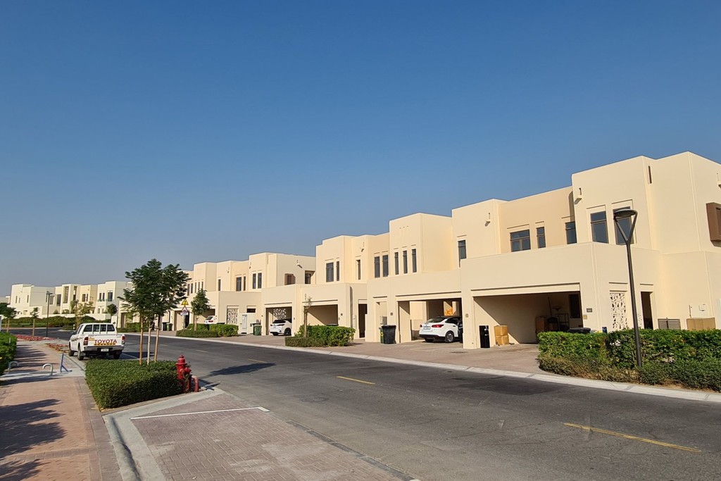 A residential street in Mira Oasis 3, featuring well-maintained homes and greenery typical of suburban living.