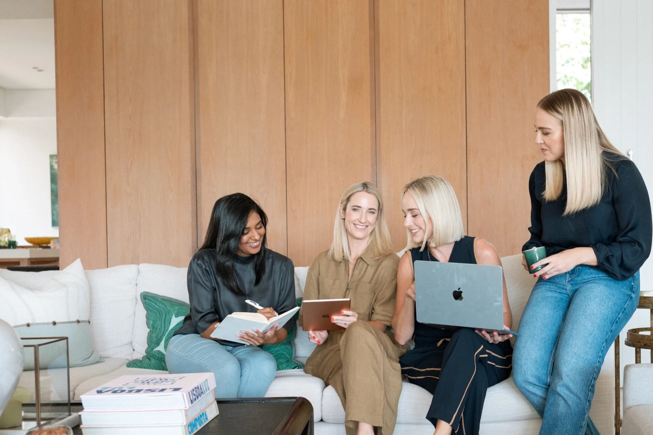 Talented Recruitment team of global recruitment specialists collaborating on candidate sourcing in their Ballito office.