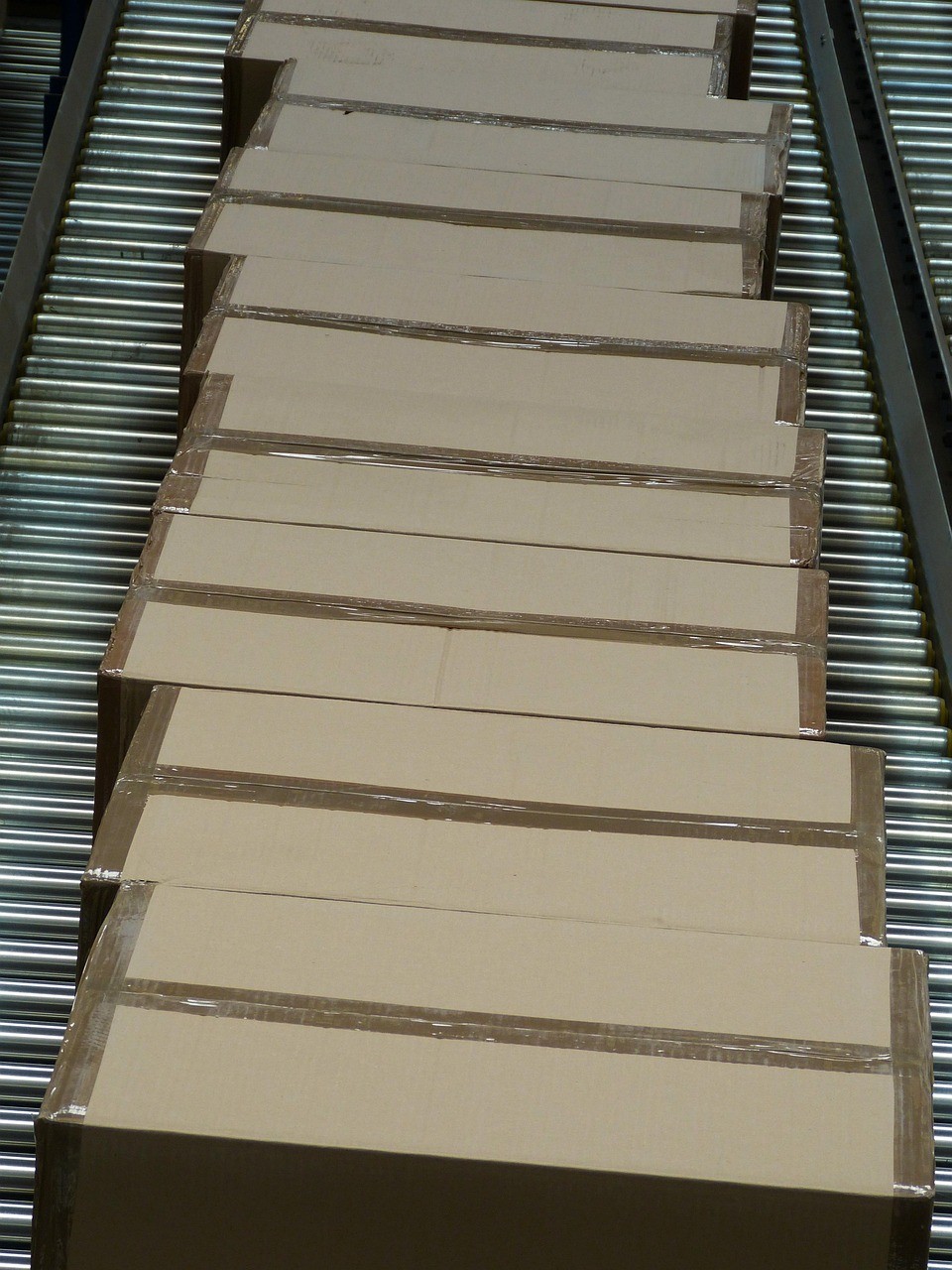 a conveyor belt in a warehouse filled with bags