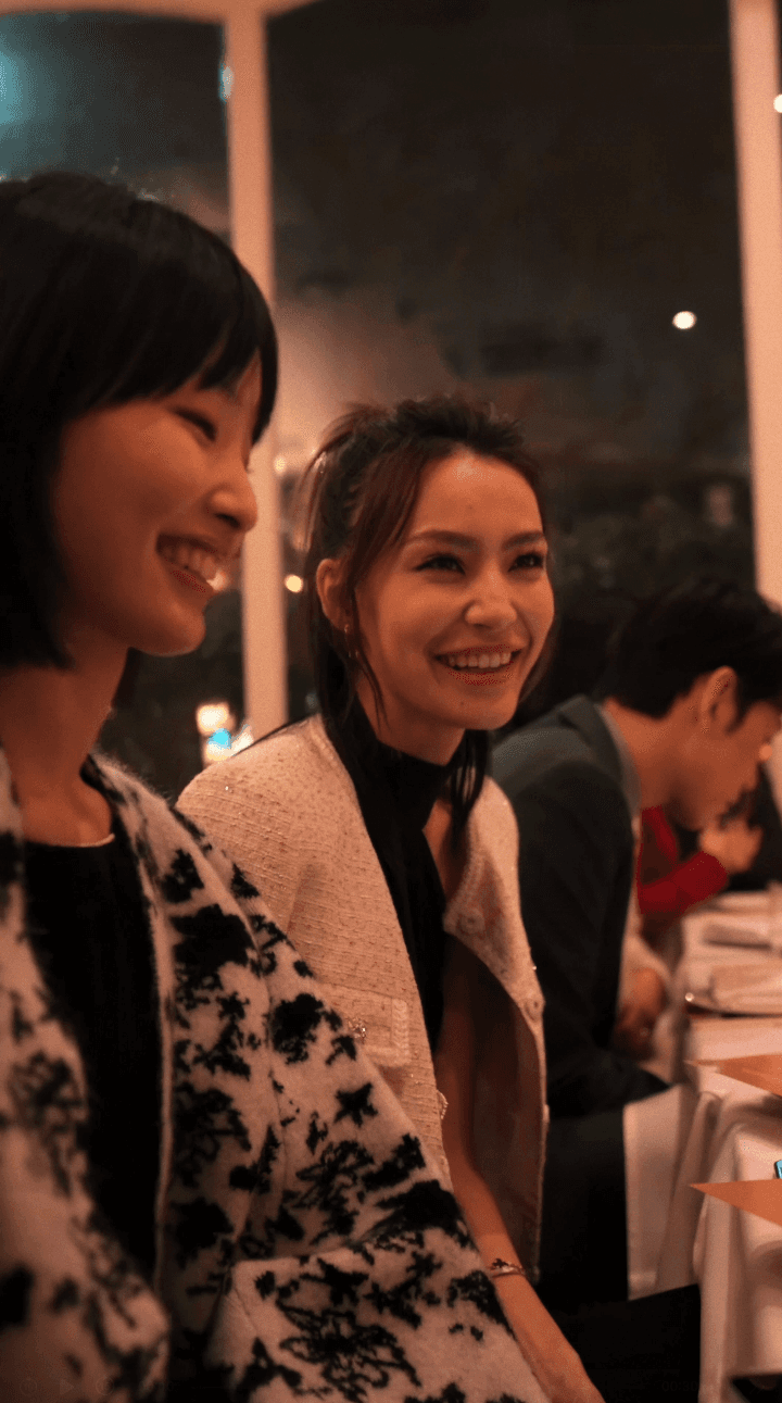 Close-up of bride and groom's torsos, bride in white dress