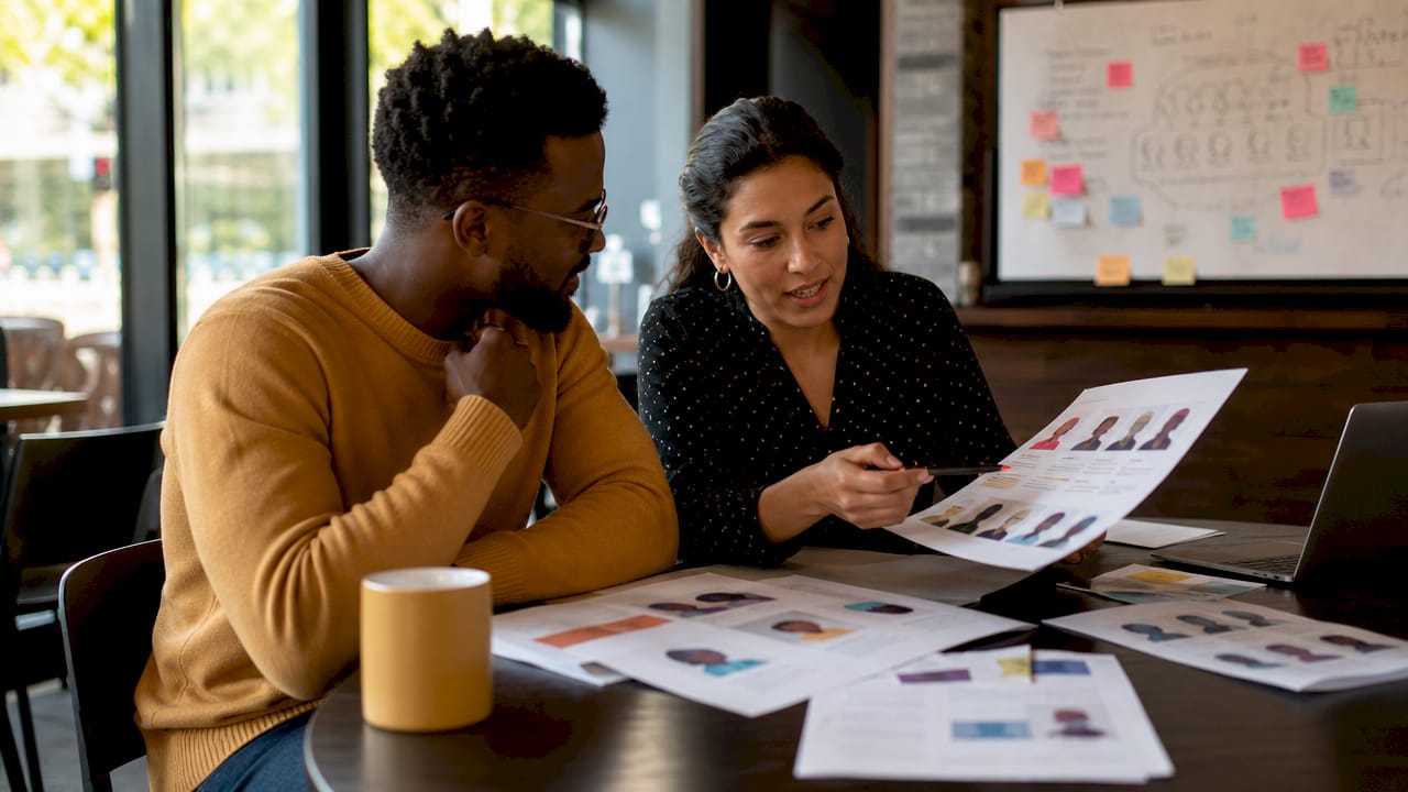 Team discussing buyer personas with charts