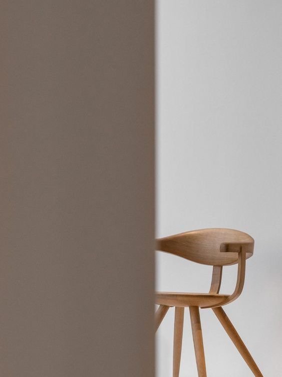 image from Cor&Co website - stylistic image of a wooden chair