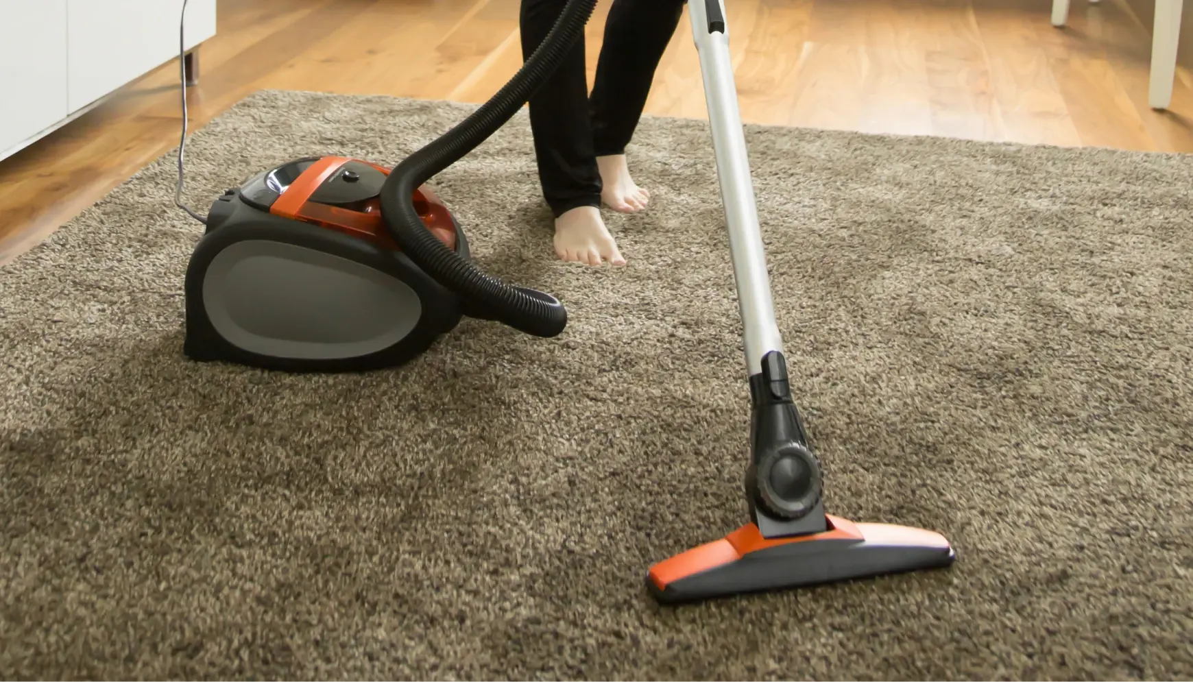 Professional carpet vacuuming with industrial vacuum cleaner removing dirt, Charleville