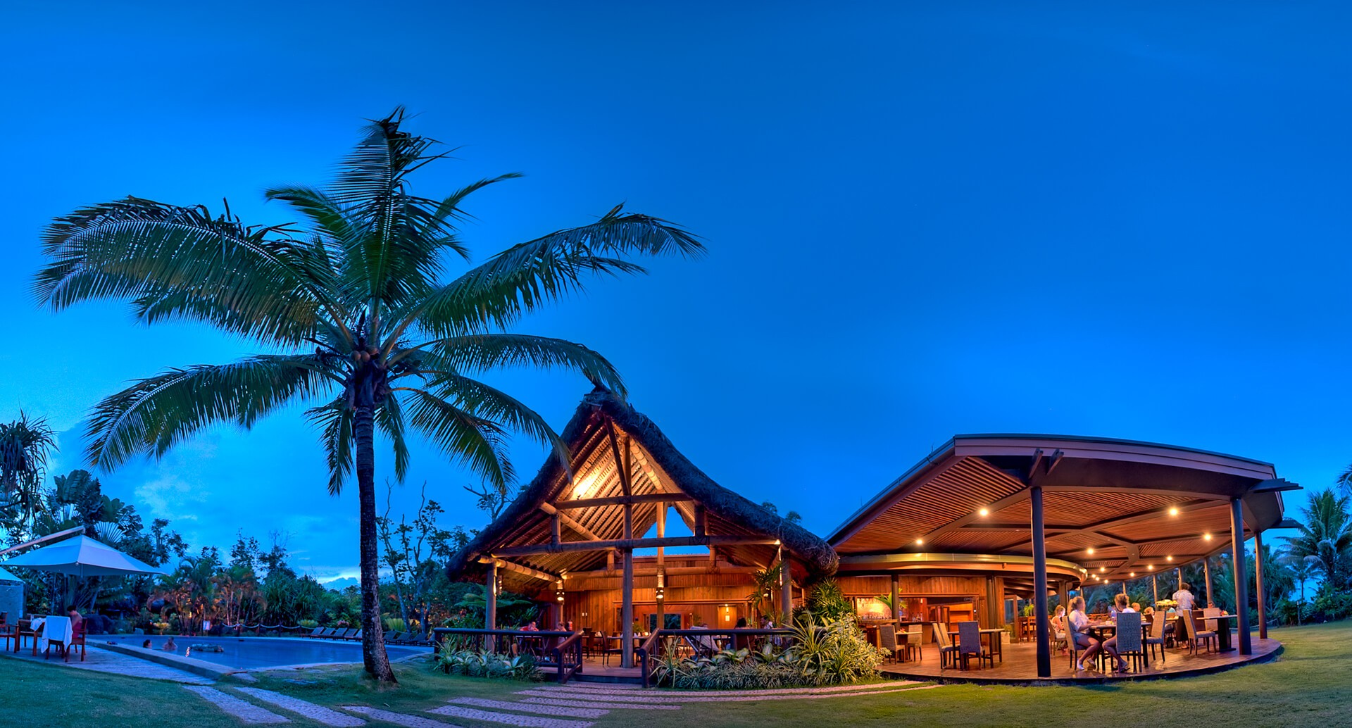 Main restaurant at Uprising Resort Fiji, at twilight, ambient lighting