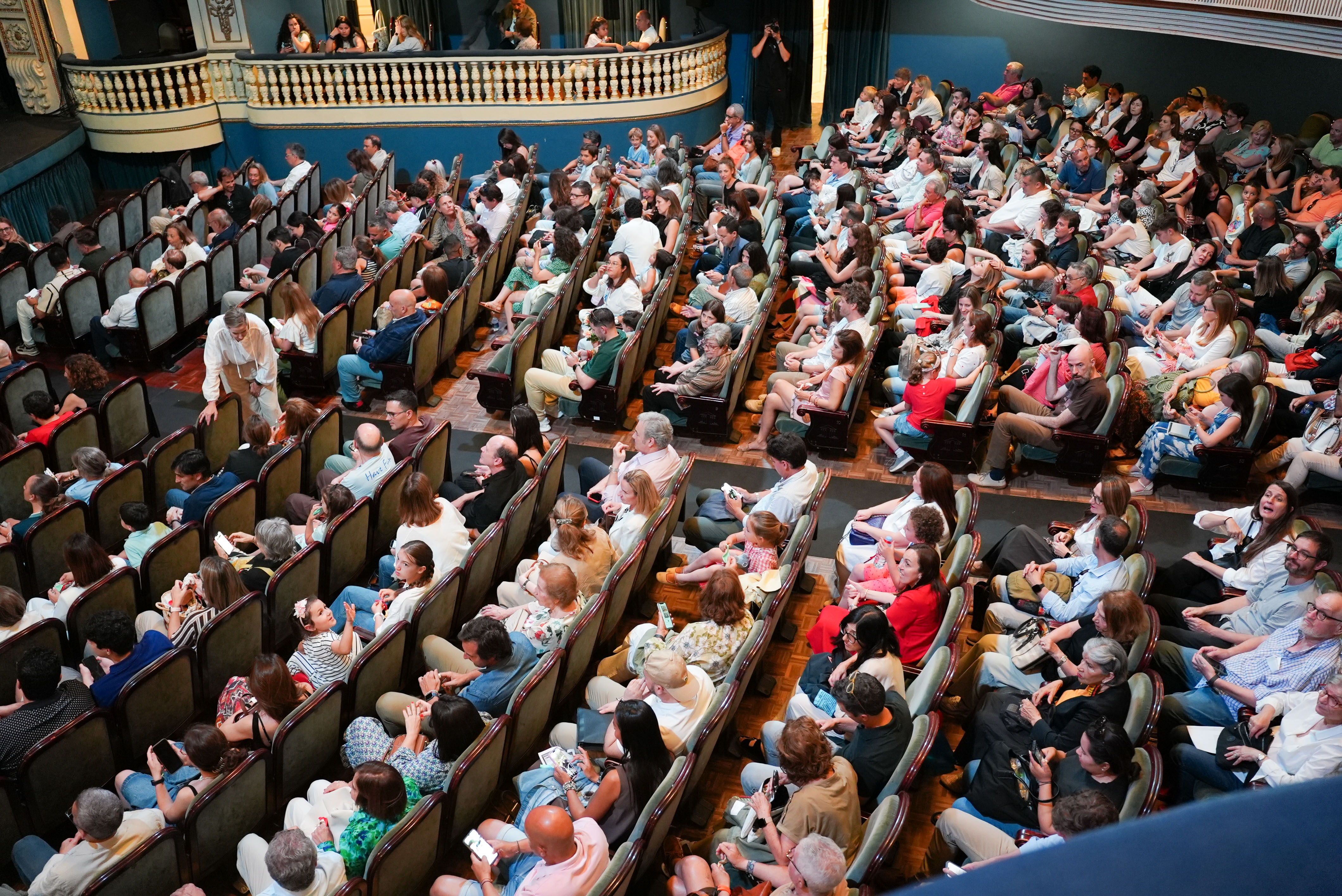 A woman with a head made of mirrors, reflecting light and creating a kaleidoscopic effect around her.