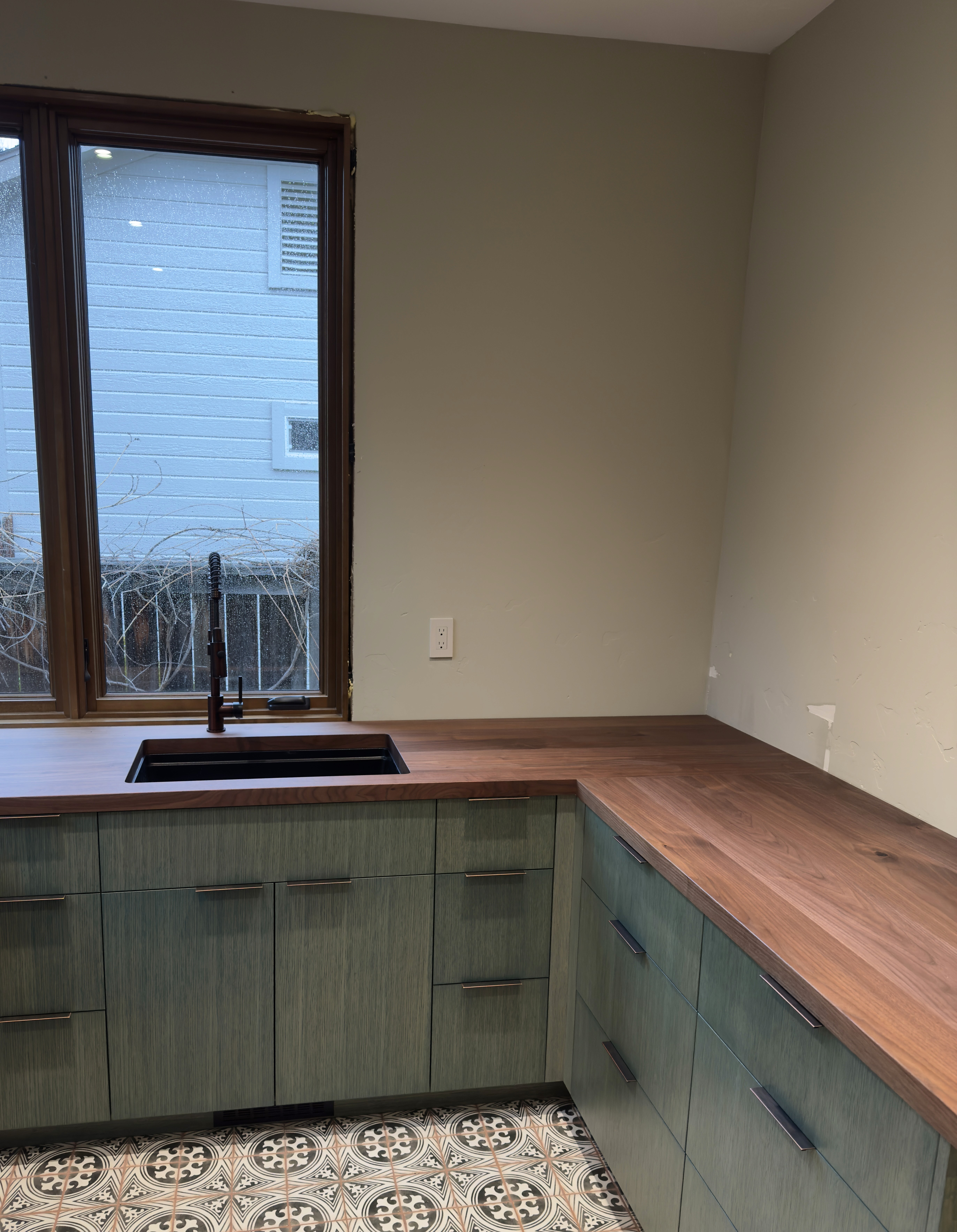 Close-up of a tree stump showing growth rings and a textured brown wood surface.