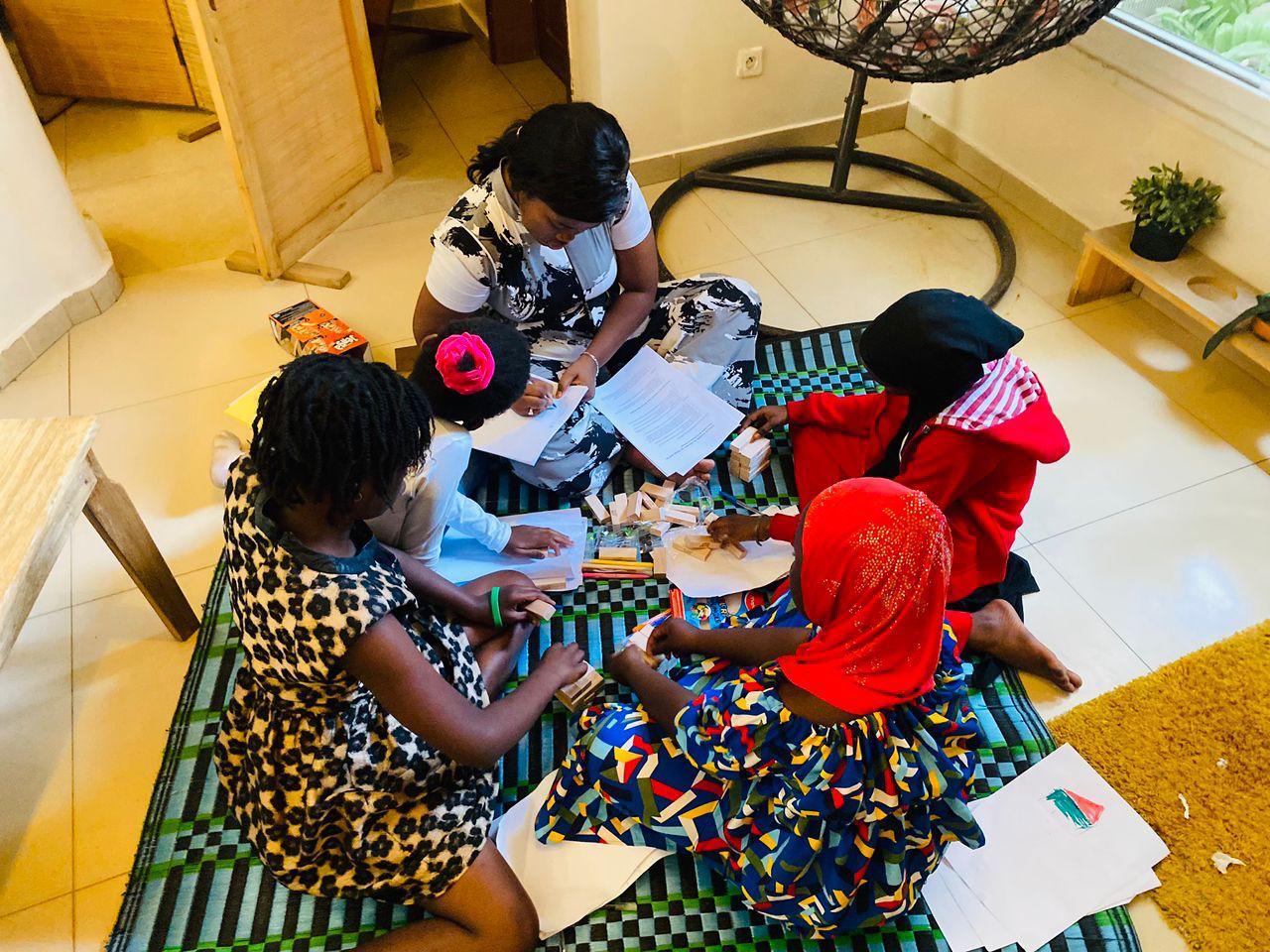 group of women in red and white dress standing on brown wooden bar during daytime