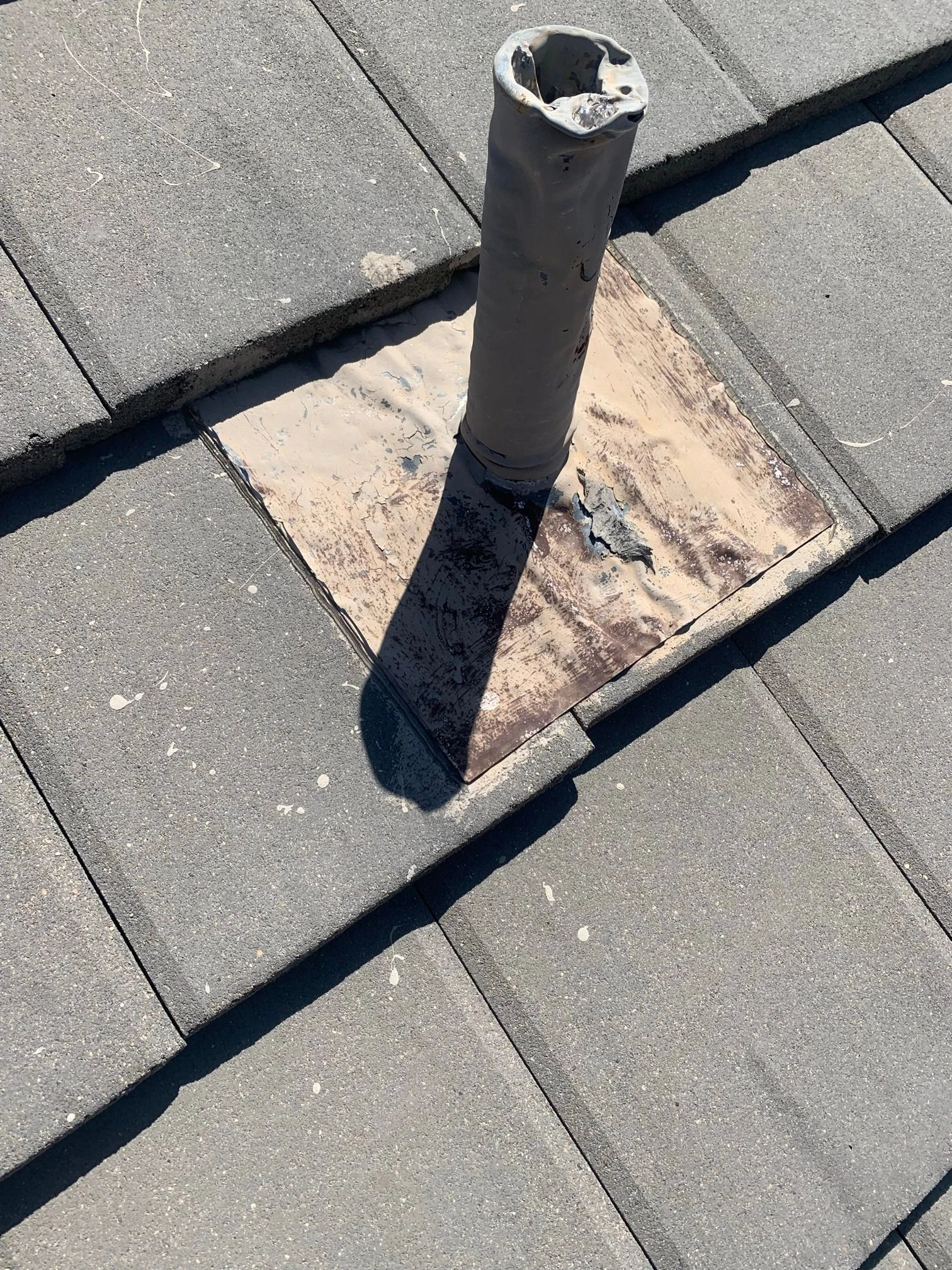 Before repair: tile roof vent and flashing repairs in San Antonio, Texas.