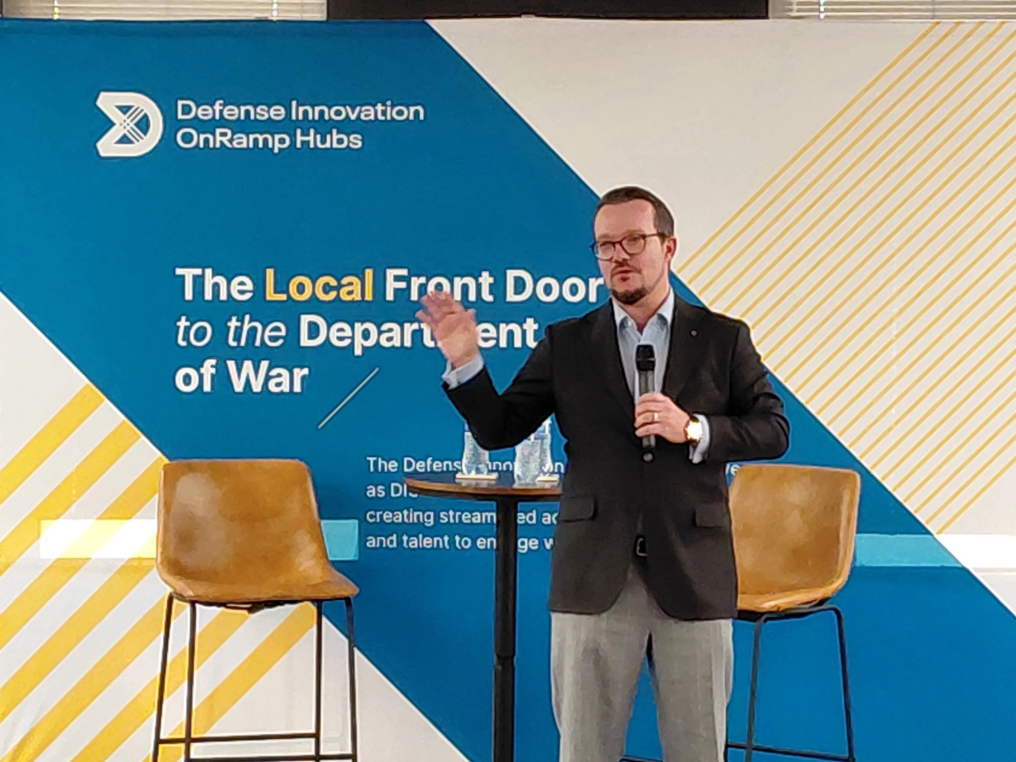 a black and white living room with a large tv