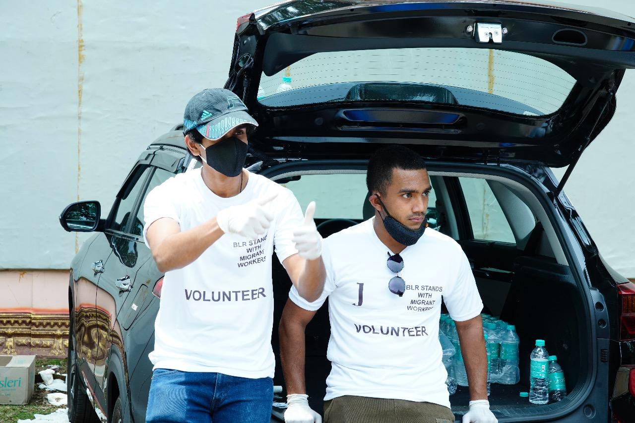a group of children sitting on steps in front of a building