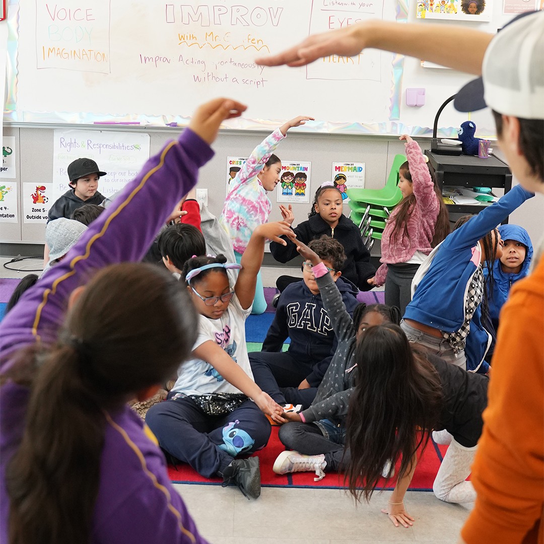 Youth performers practicing improvisation exercises in structured drama class
