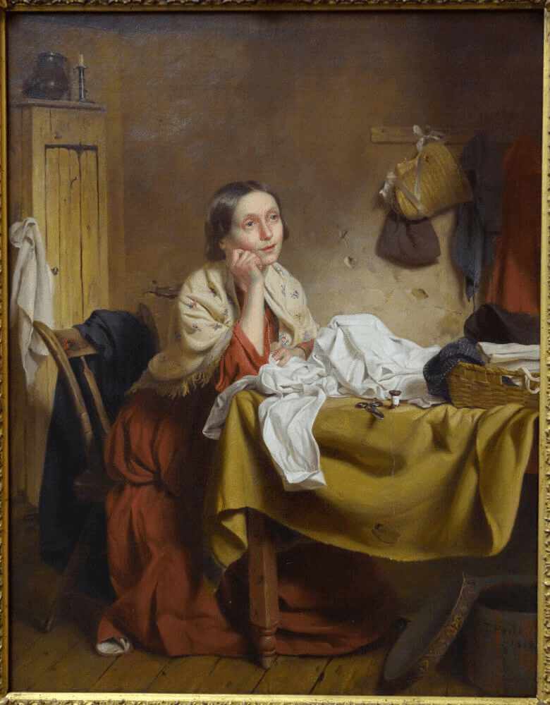 Woman sitting at a table, hands clasped, with a sewing project and a cozy room backdrop.