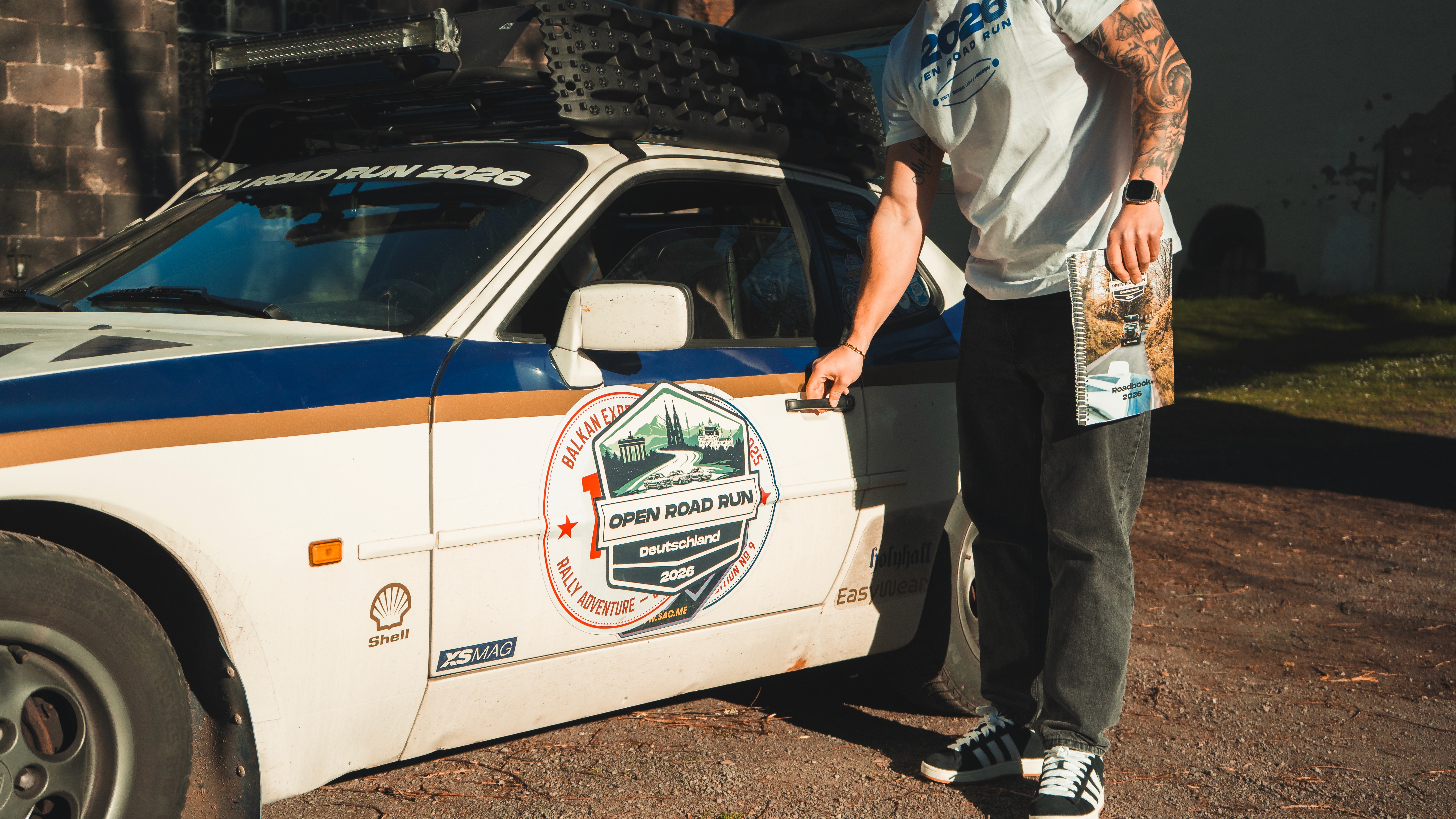 Rock formations and open trails in desert landscape.