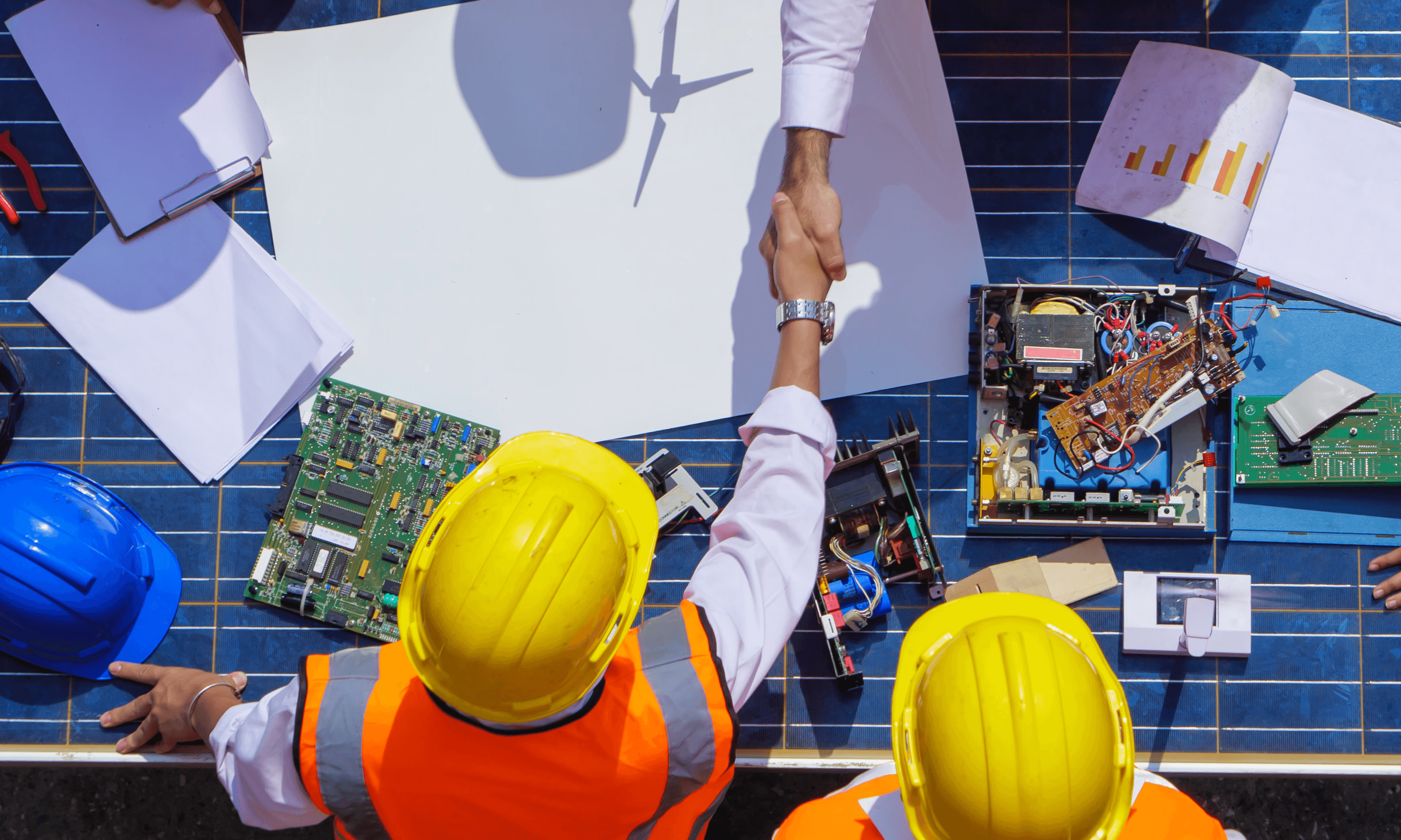 Engineers reviewing a solar PV continuity plan for essential services.