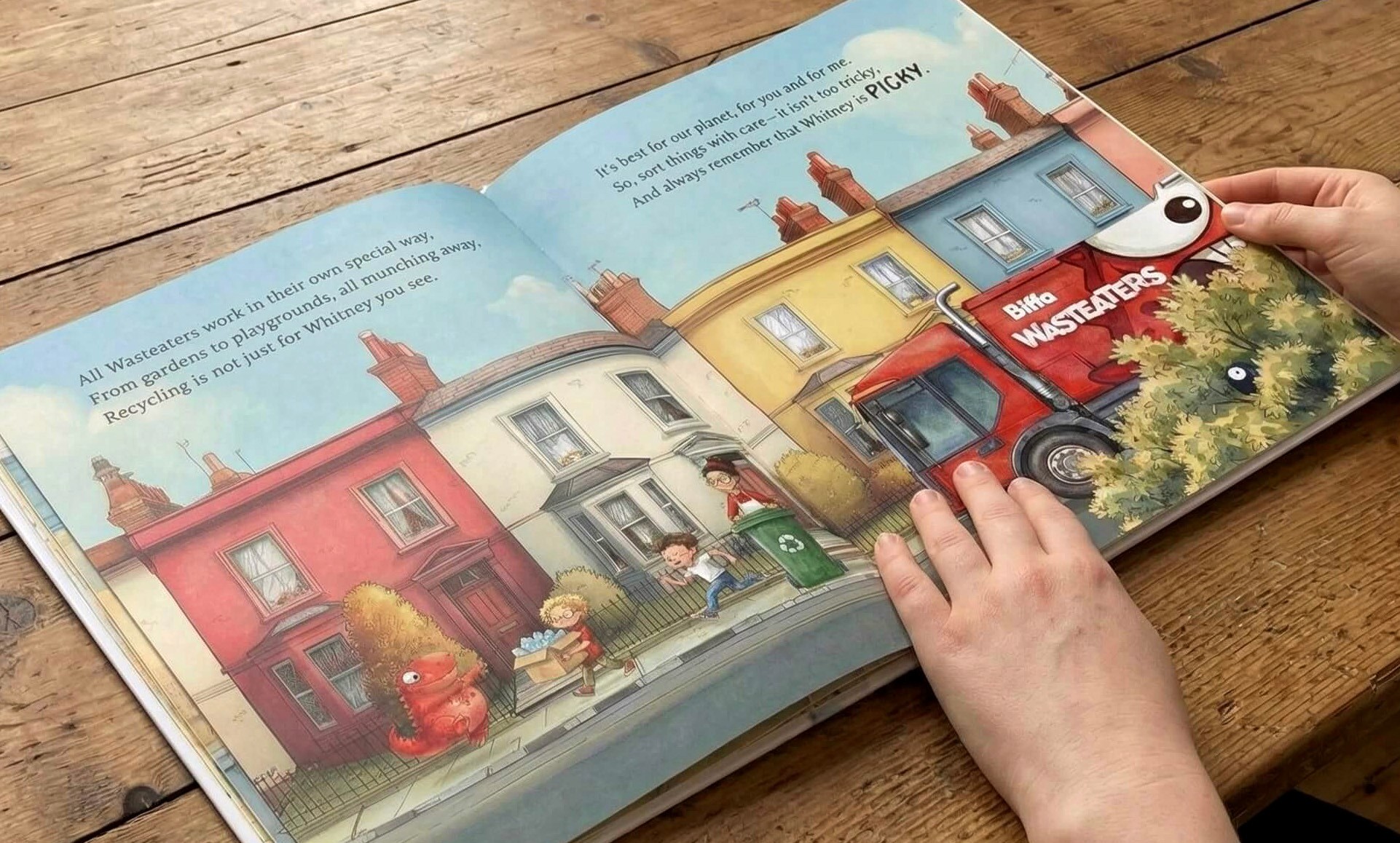 A blue plaque on a brick wall reads 'Carmen lived here in 2021. Eviction left Carmen homeless. Thanks to your donations, we helped her find a flat she now calls home.'