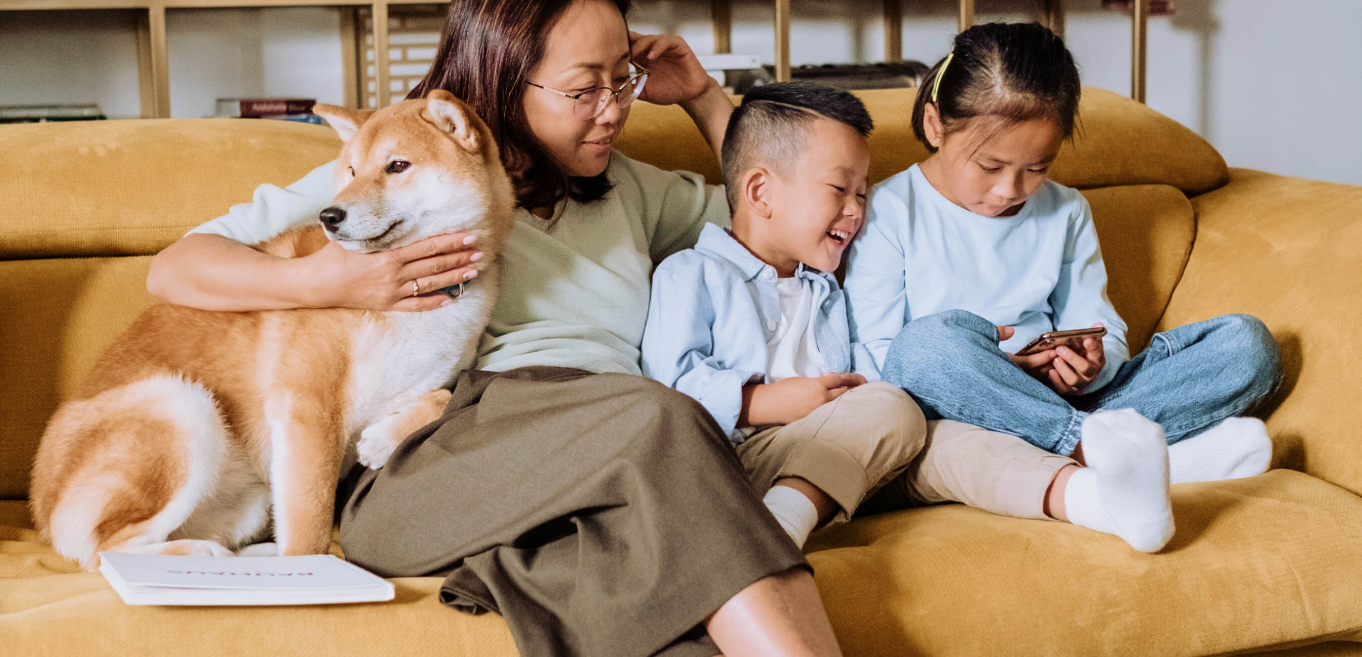 Family on couch with tablet