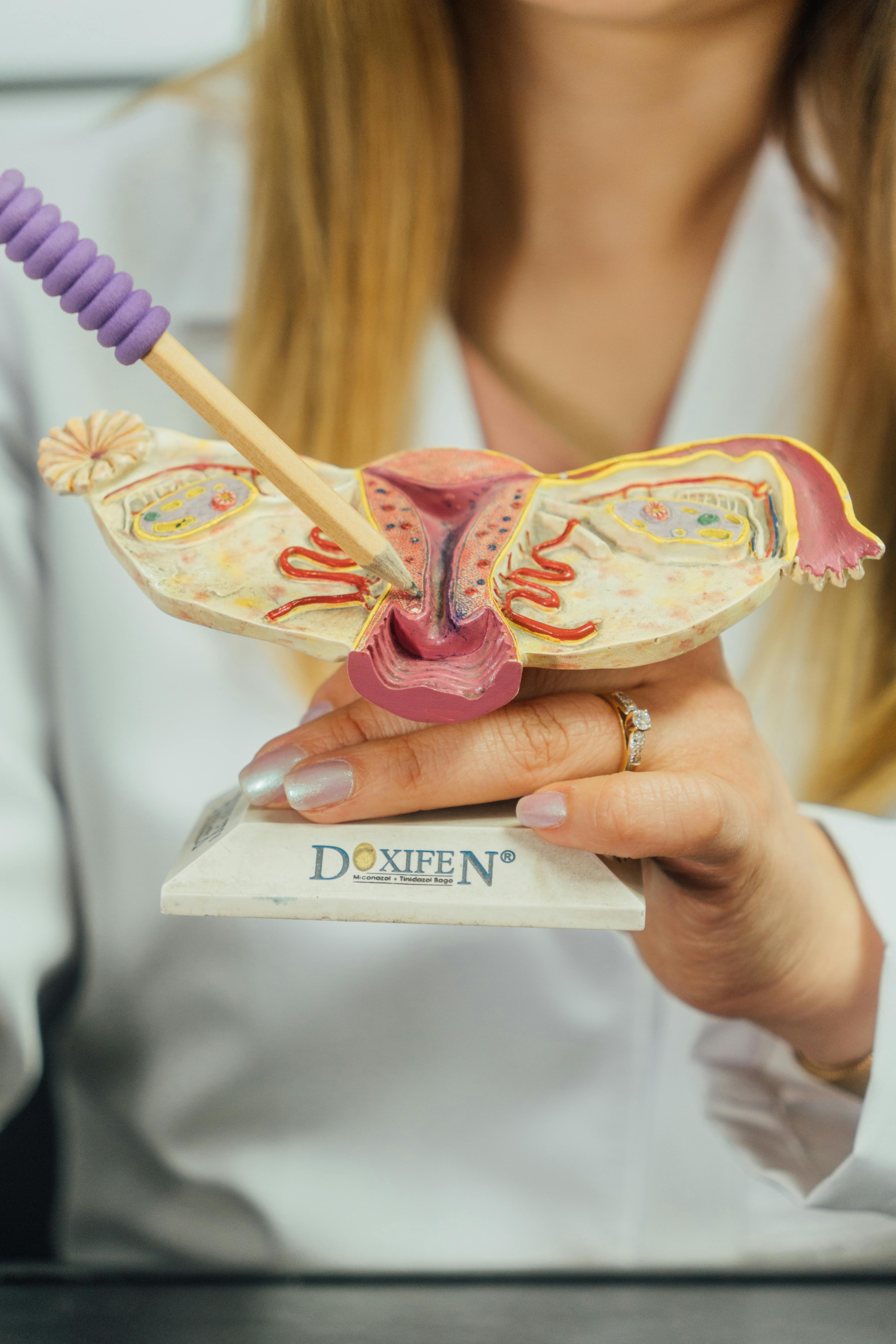 Hospital consultation setting, doctor explaining treatment plan on tablet, respectful framing, non-graphic.