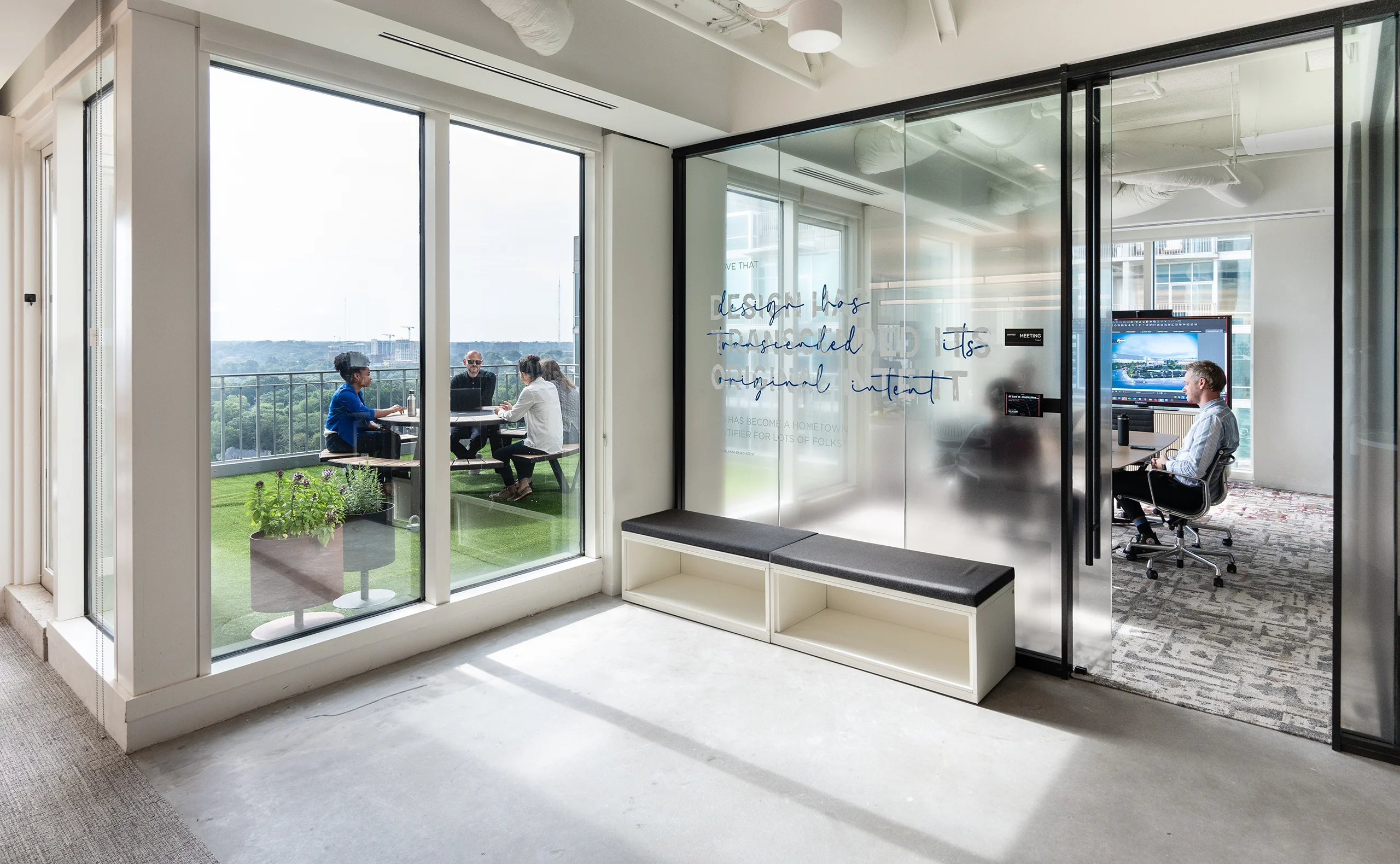 Streetside billboard with flyposters of the Batch.Works brand and illustrations