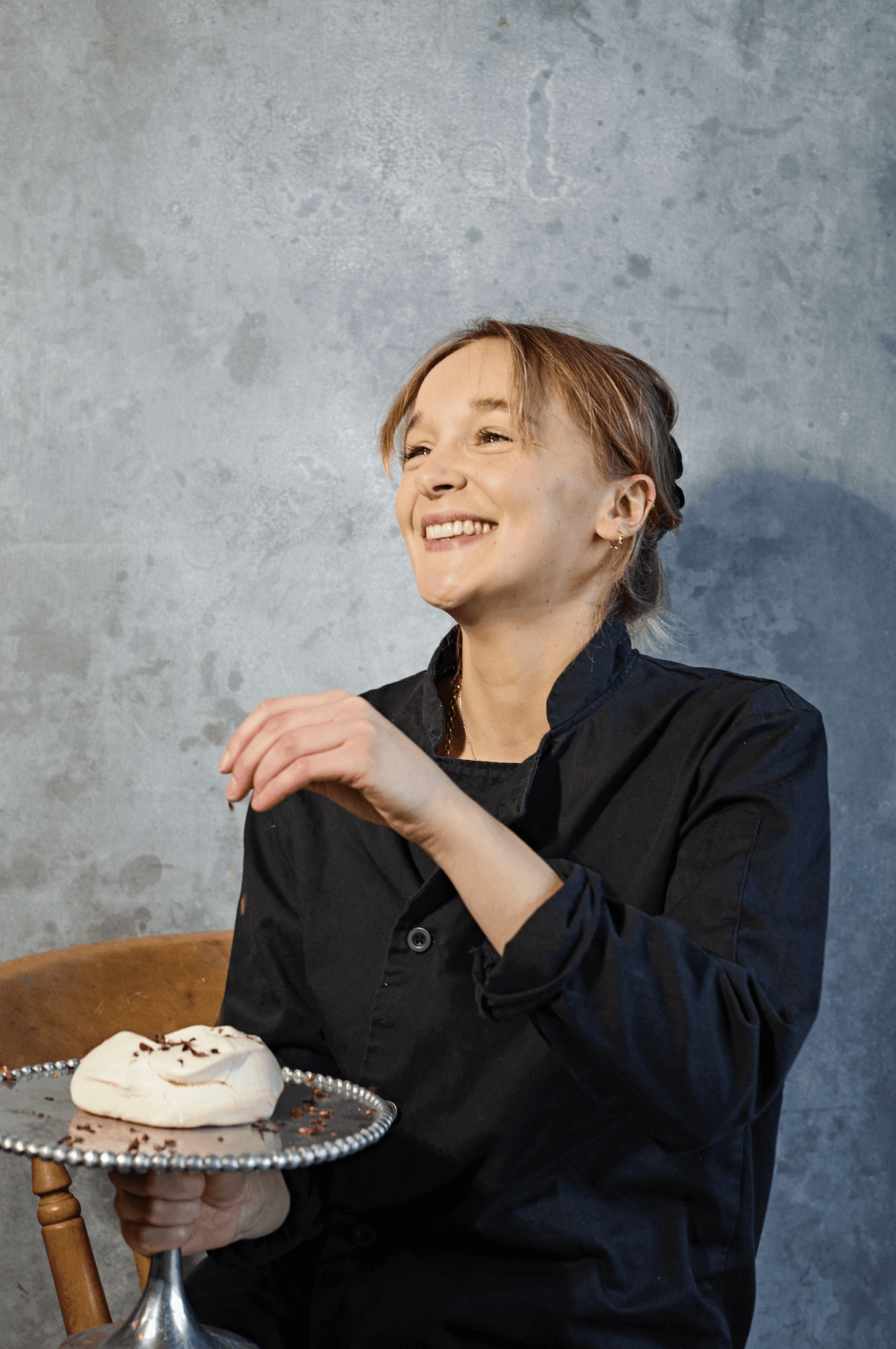 Flora Ashton, Founder of Flavour by Flora springling a meringue