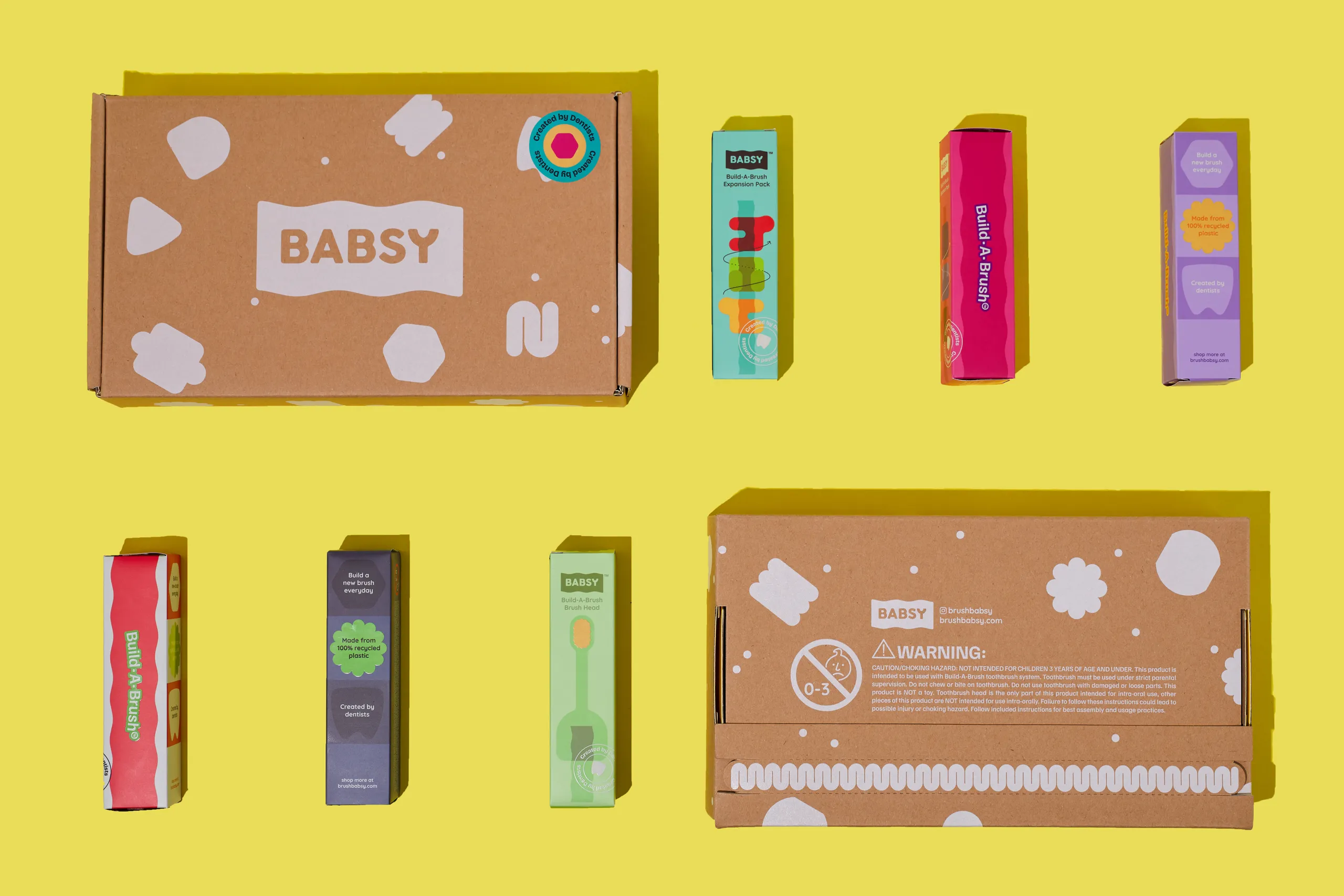 BABSY Build-A-Brush boxes and colorful component packages arranged as a packaging system