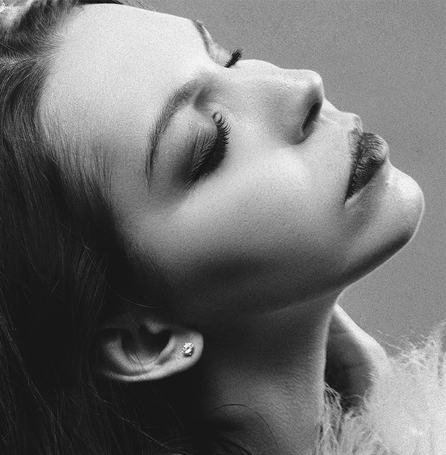 grayscale photography of woman with two hands on her face