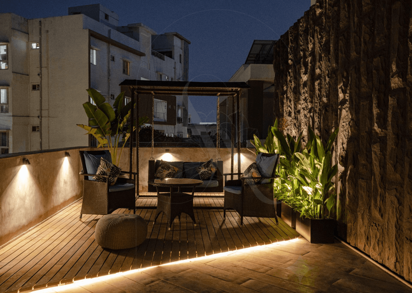 A cozy and private rooftop with ambient lighting 