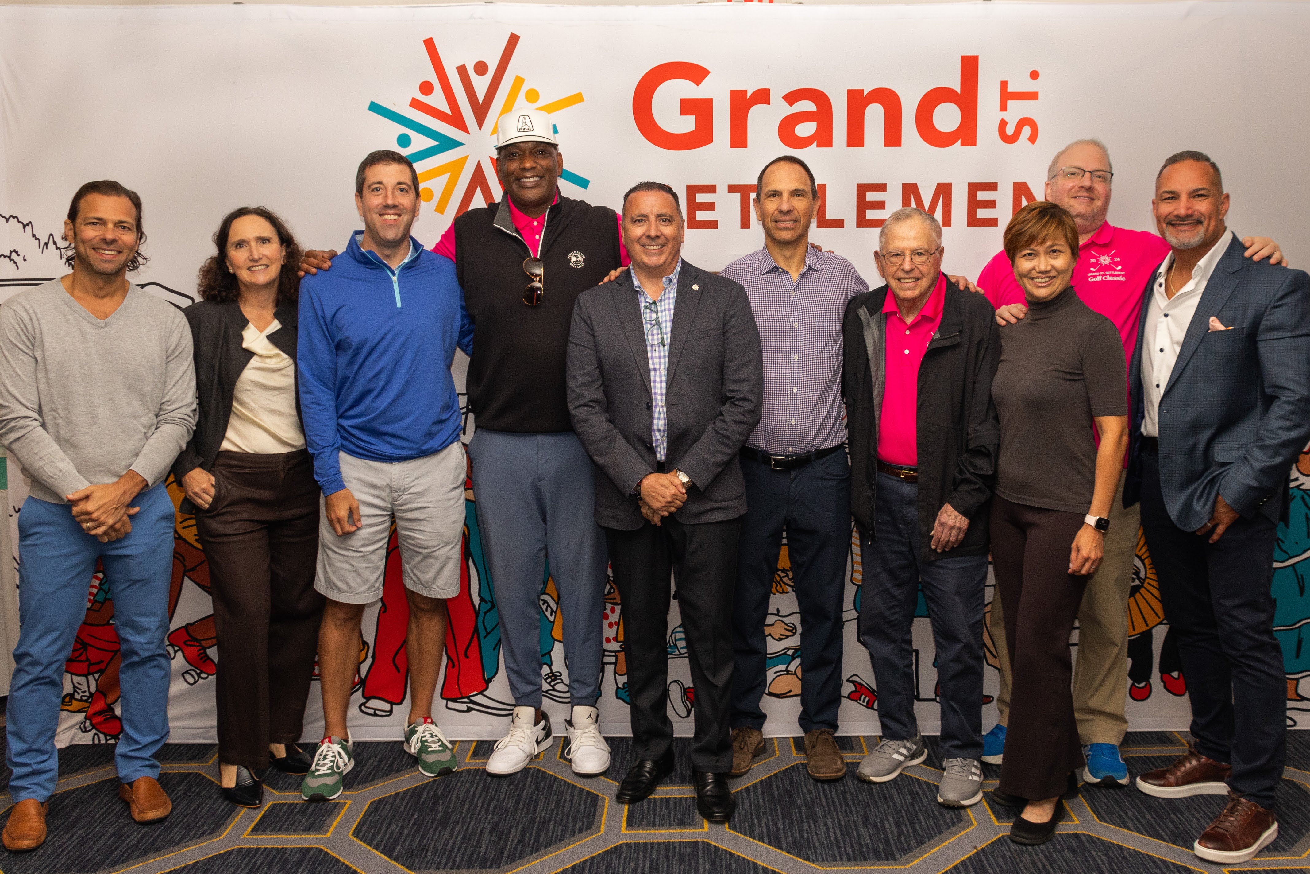 Grand St. Settlement board members pose for a photo