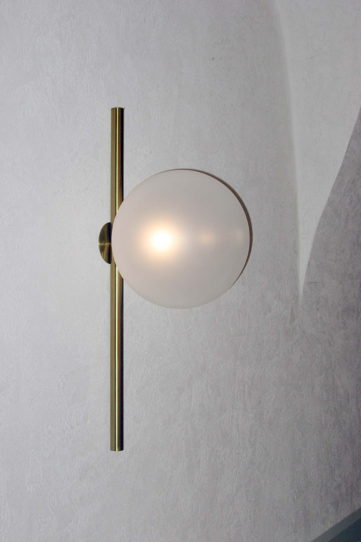 Close-up of Luna I01 wall light showing sandblasted glass sphere and soft light diffusion by Jiri Krejcirik