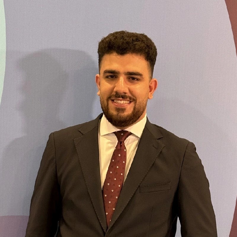 Black and white portrait of a man with a beard and glasses