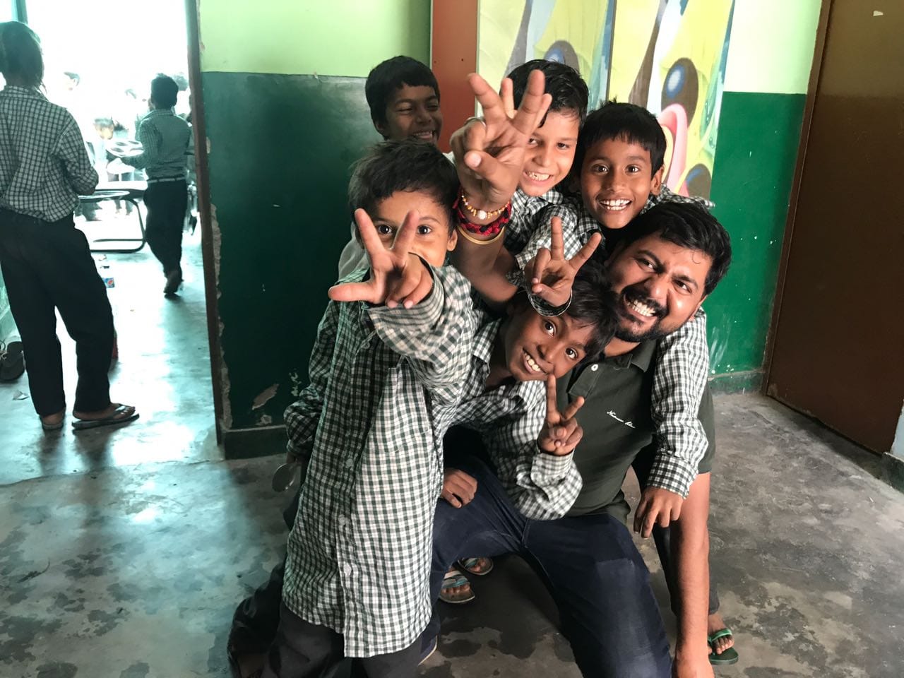 three children at the beach during golden hour
