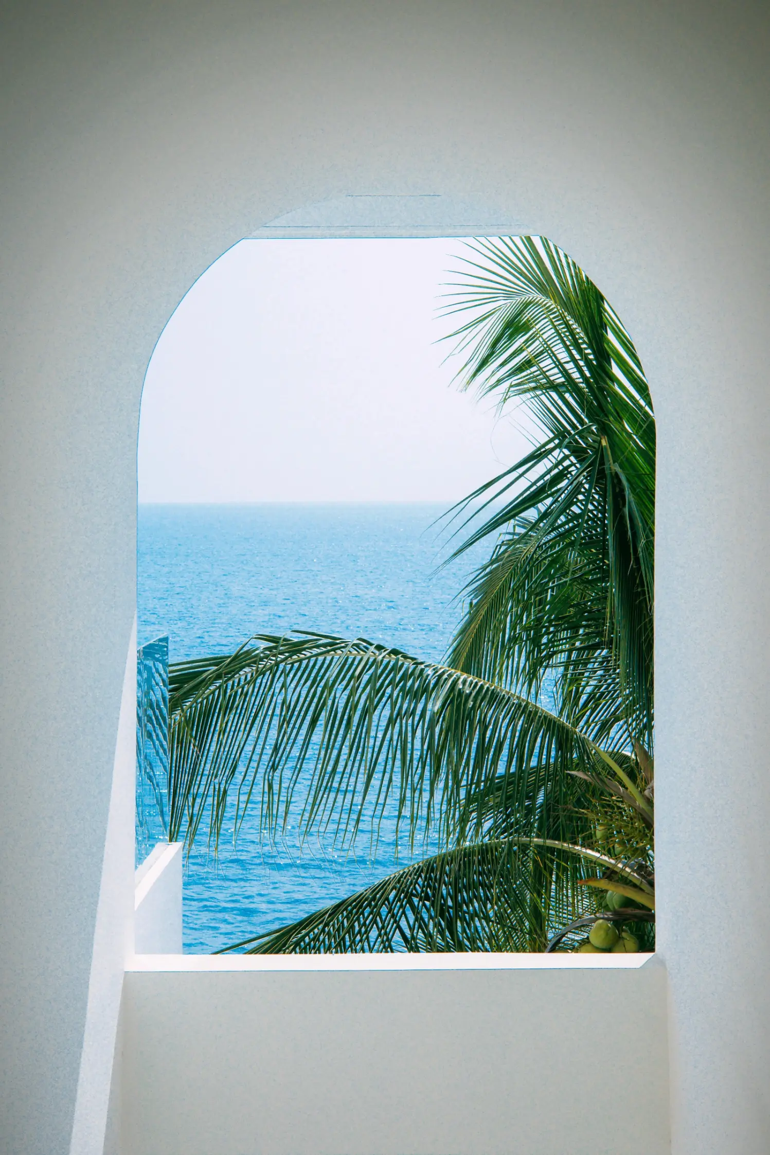 a view of the ocean through a window